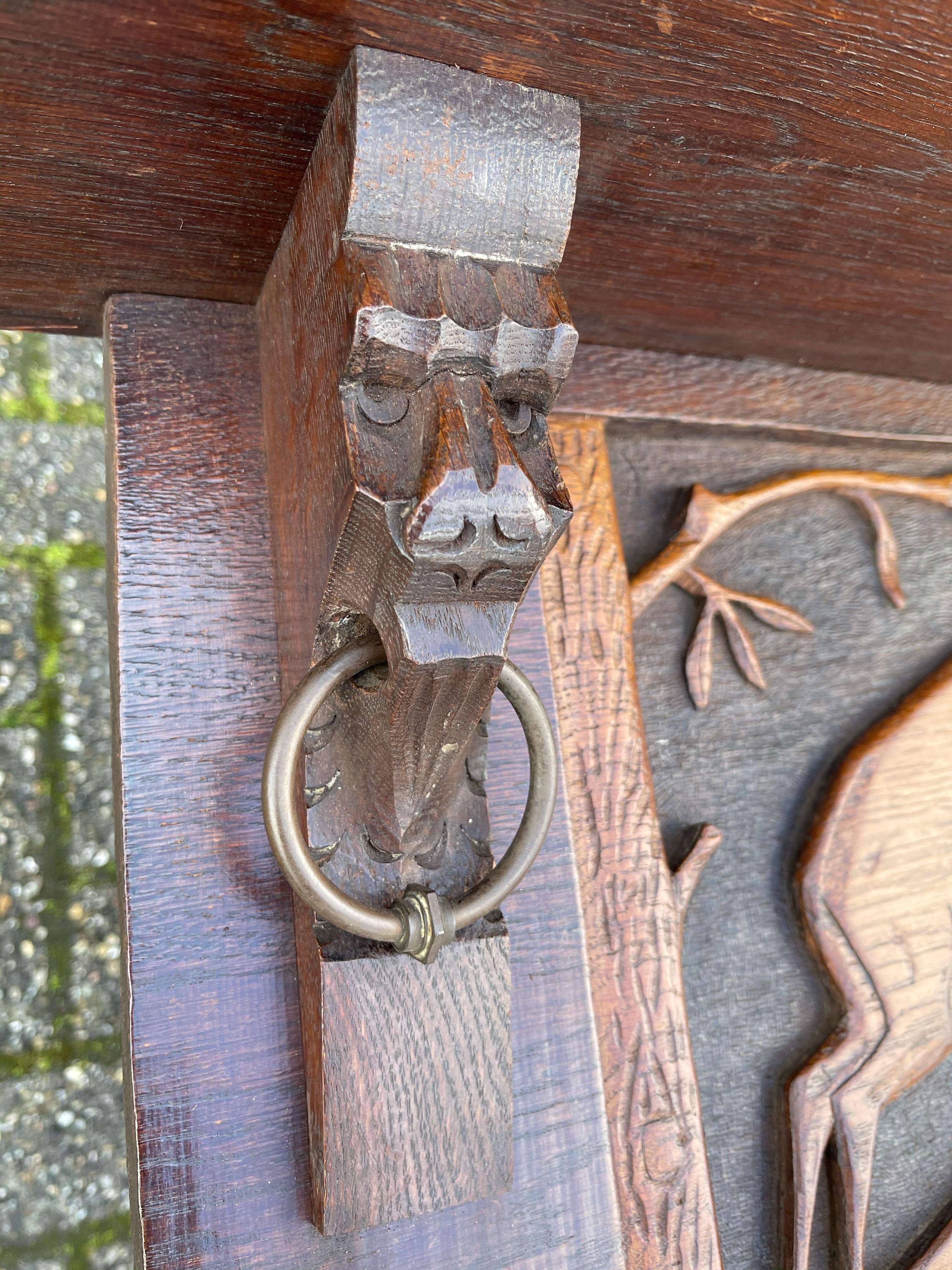 European Antique Arts & Crafts Coat Rack w. Brass Hooks & A Carved Decor of a Deer Fight