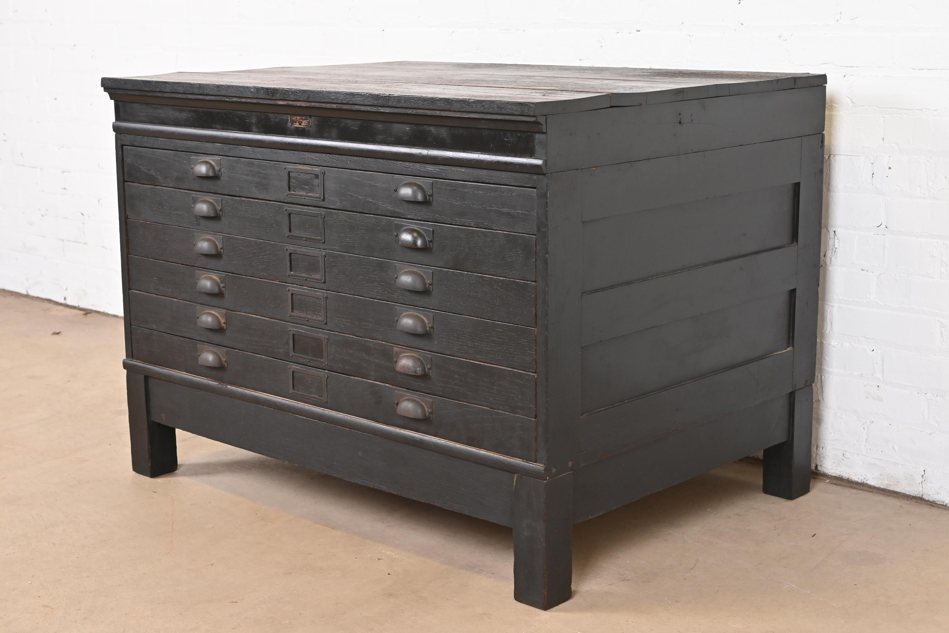 A rare antique Arts & Crafts six-drawer architect's blueprint or map flat file cabinet

In the manner of Hamilton Manufacturing Co.

USA, Circa 1900

Oak in ebonized finish, with original hardware.

Measures: 41