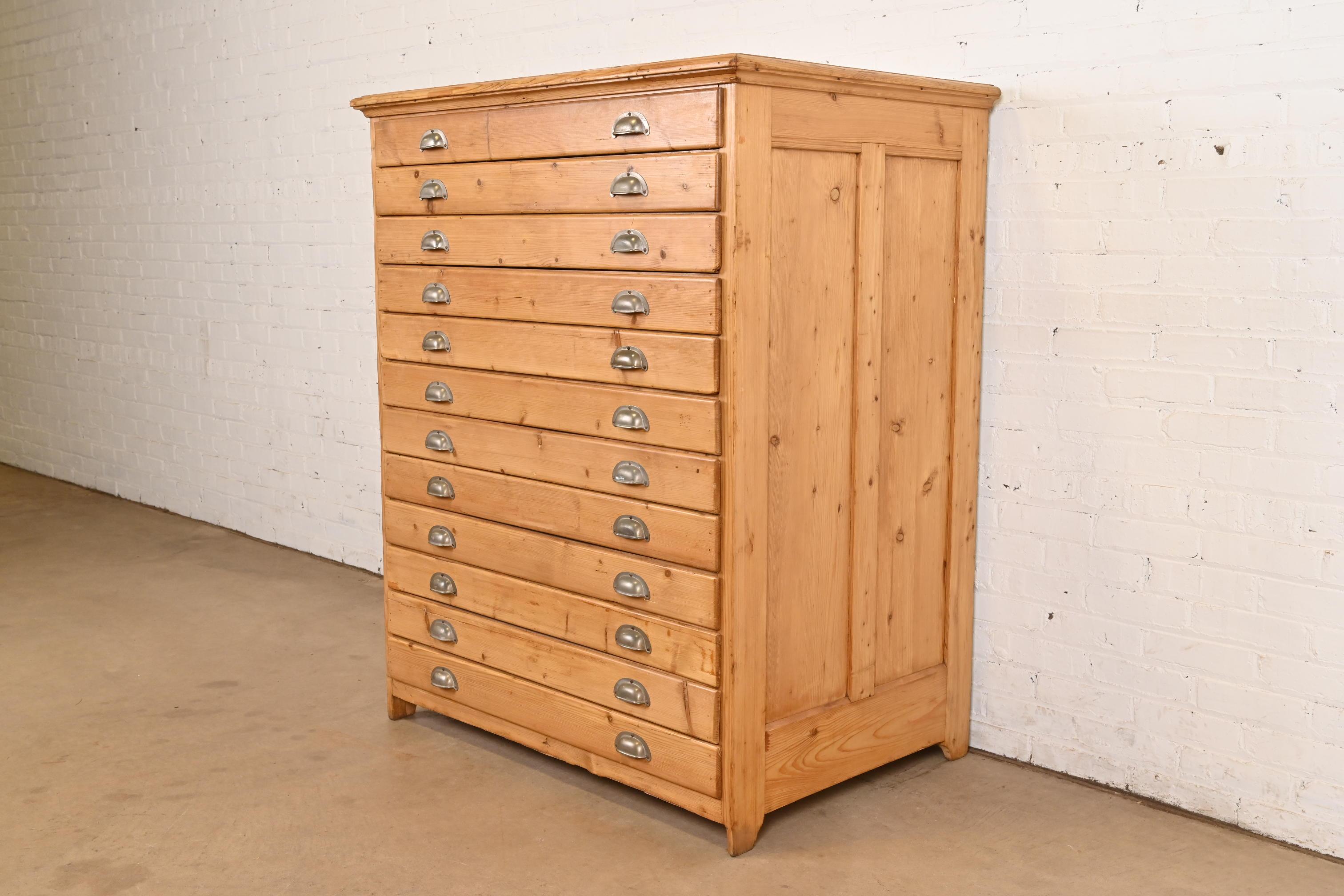 A rare and exceptional antique Arts & Crafts period 12-drawer English pine architect's blueprint flat file cabinet, map file, or art cabinet

In the manner of Hamilton

England, Circa 1900

Measures: 43.25