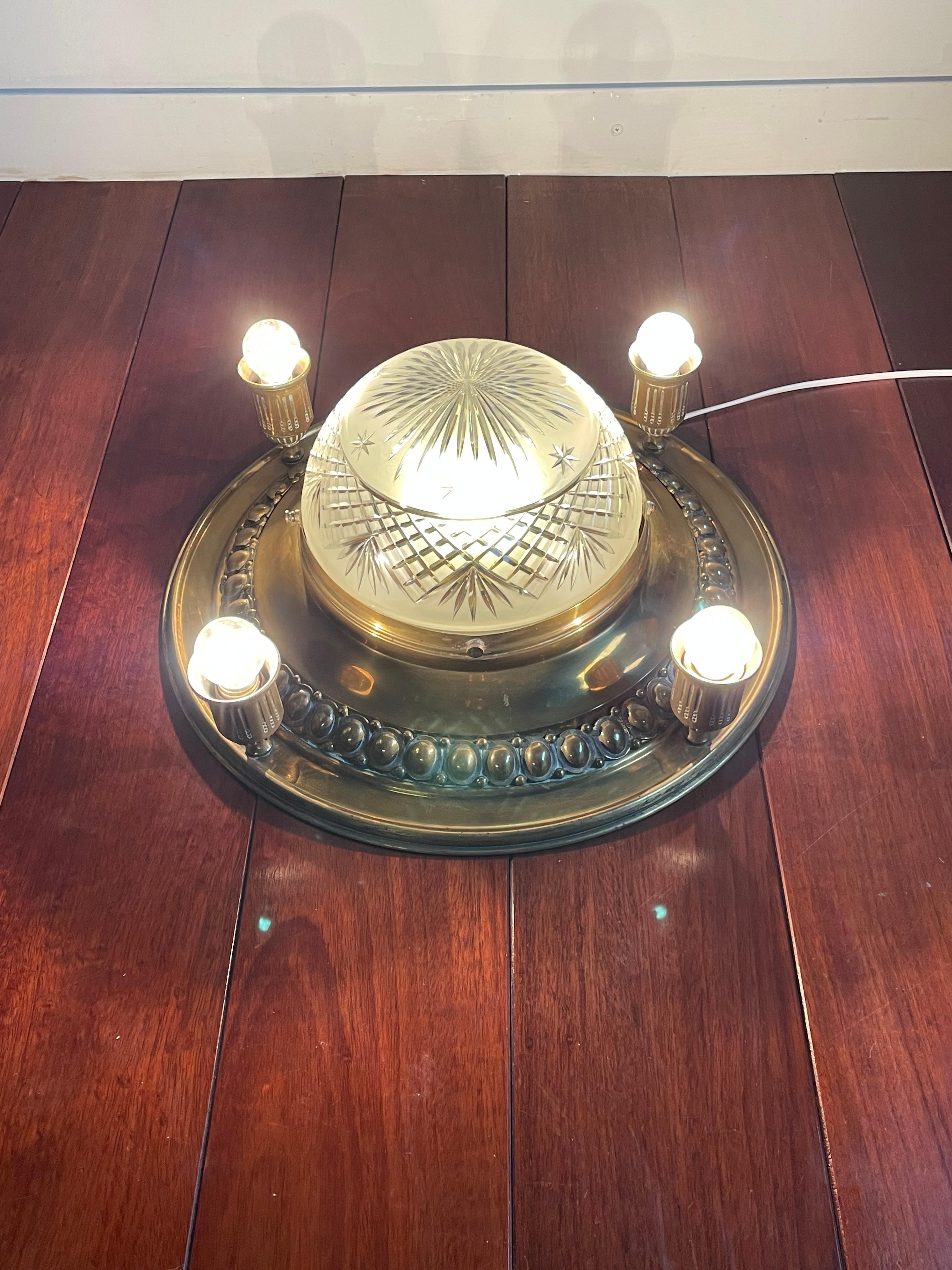 Rare and great looking, early 20th century, large ceiling light.

With early 20th century lighting being one of our specialities, finding this rare and extraordinary flush mount felt like a blessing. It is clear that early 20th century craftsman in