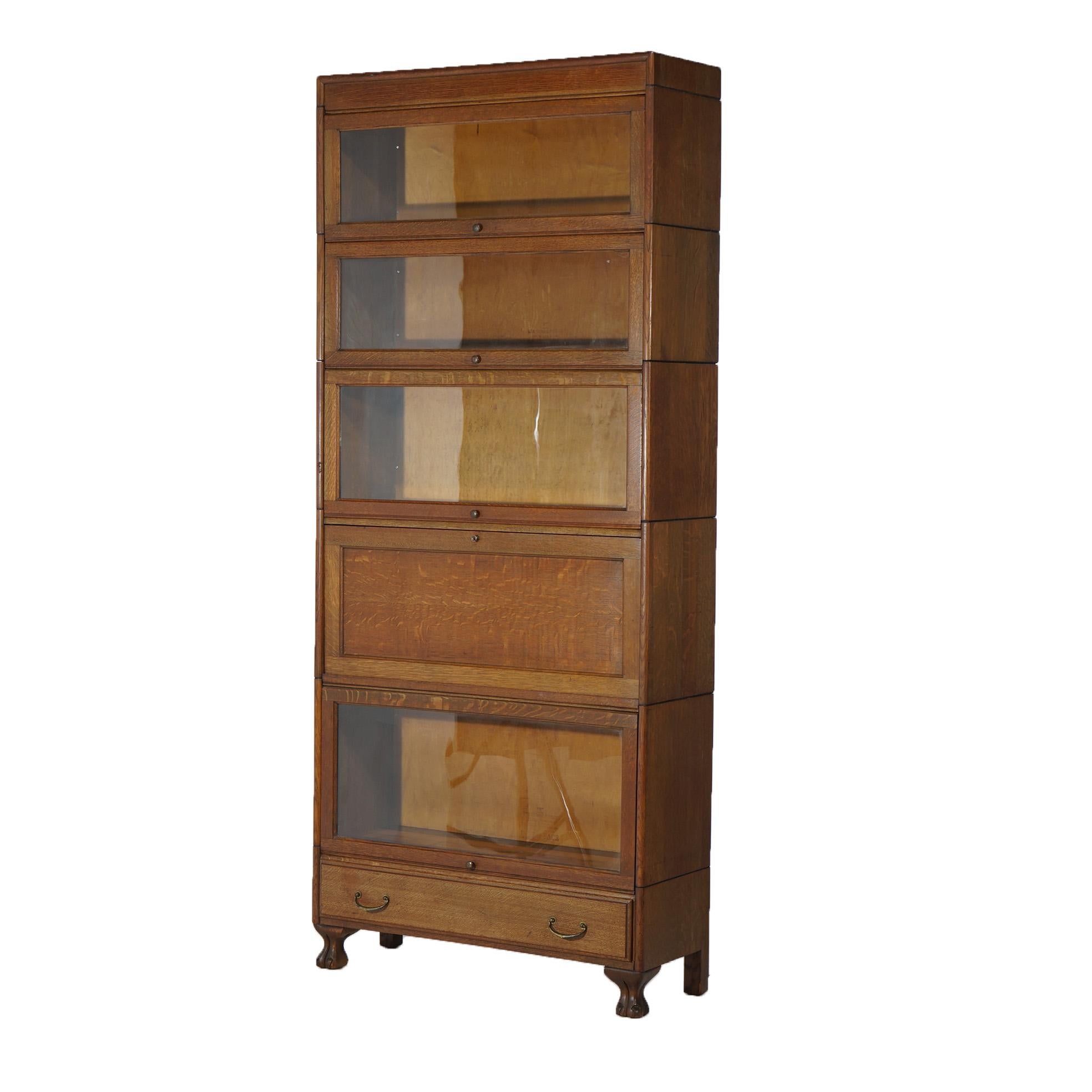 ***Ask About Reduced In-House Shipping Rates - Reliable Service & Fully Insured***
An antique Arts and Crafts barrister bookcase by Gunn offers oak construction with four stacks having pullout glass doors and a single stack having a drop down desk