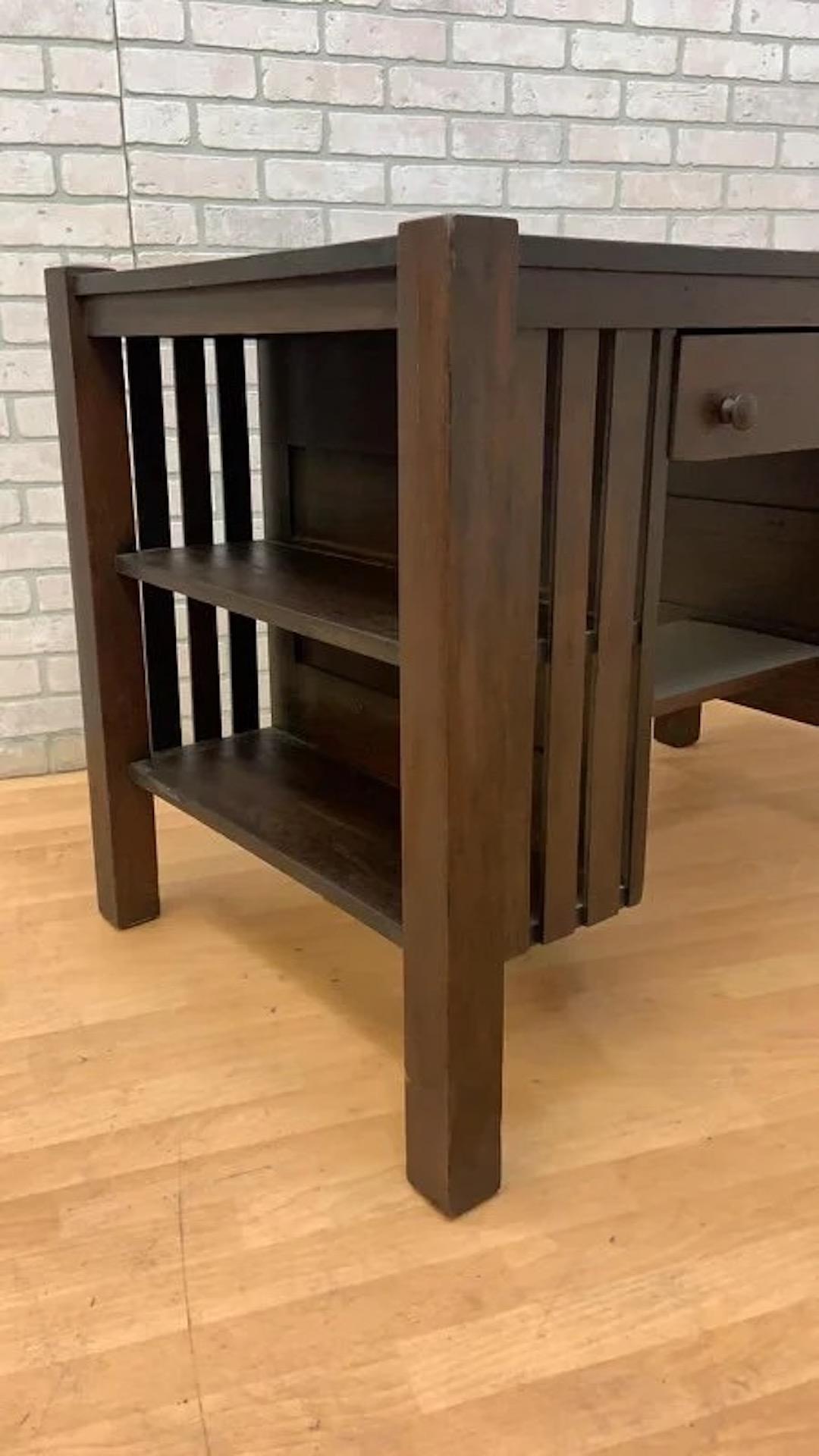 Antique Arts & Crafts Oak Mission Desk

This antique Arts & Crafts mission desk is a timeless piece that combines functionality with a classic design. Crafted from solid oak, this desk features clean lines, a spacious work surface, and ample