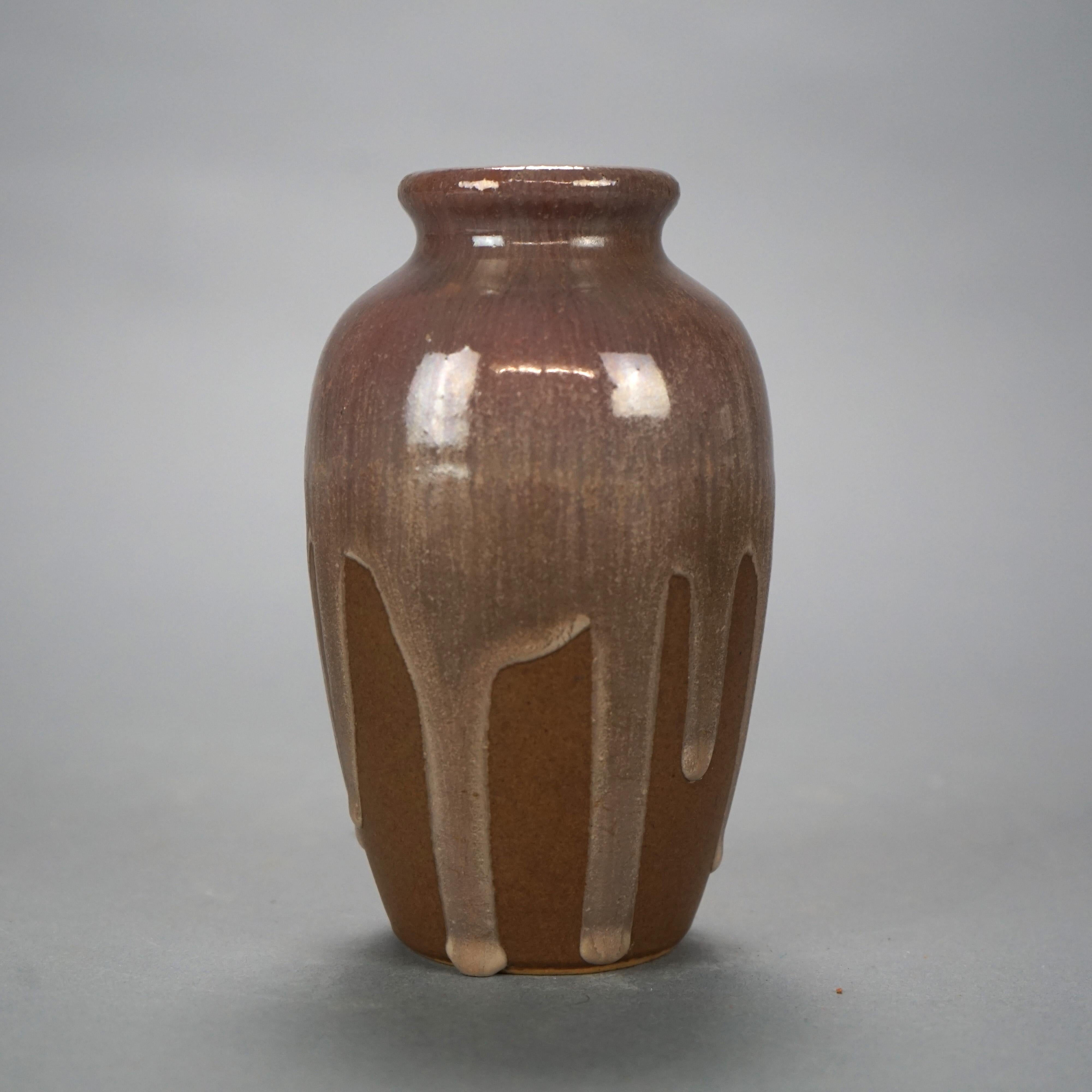 An antique Arts and Crafts vase by Fulper offers art pottery construction with drip glaze finish, maker mark on base as photographed, c1930.

Measures- 6''H x 3.5''W x 3.5''D.