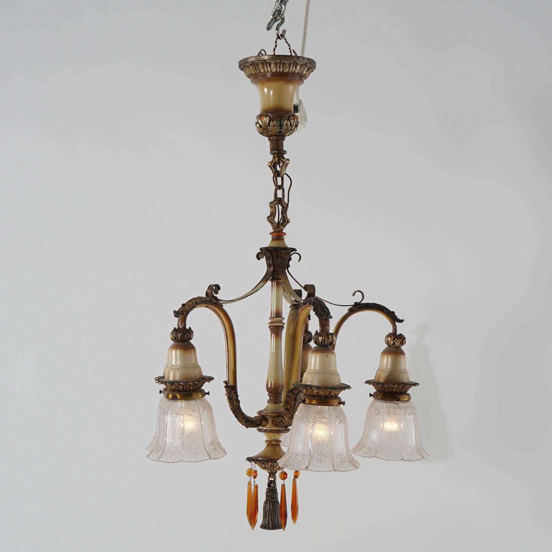 An antique Arts & Crafts five-light chandelier offers polychromed and gilt metal frame with scroll form arms and foliate elements, circa 1920

Measures - 29.5