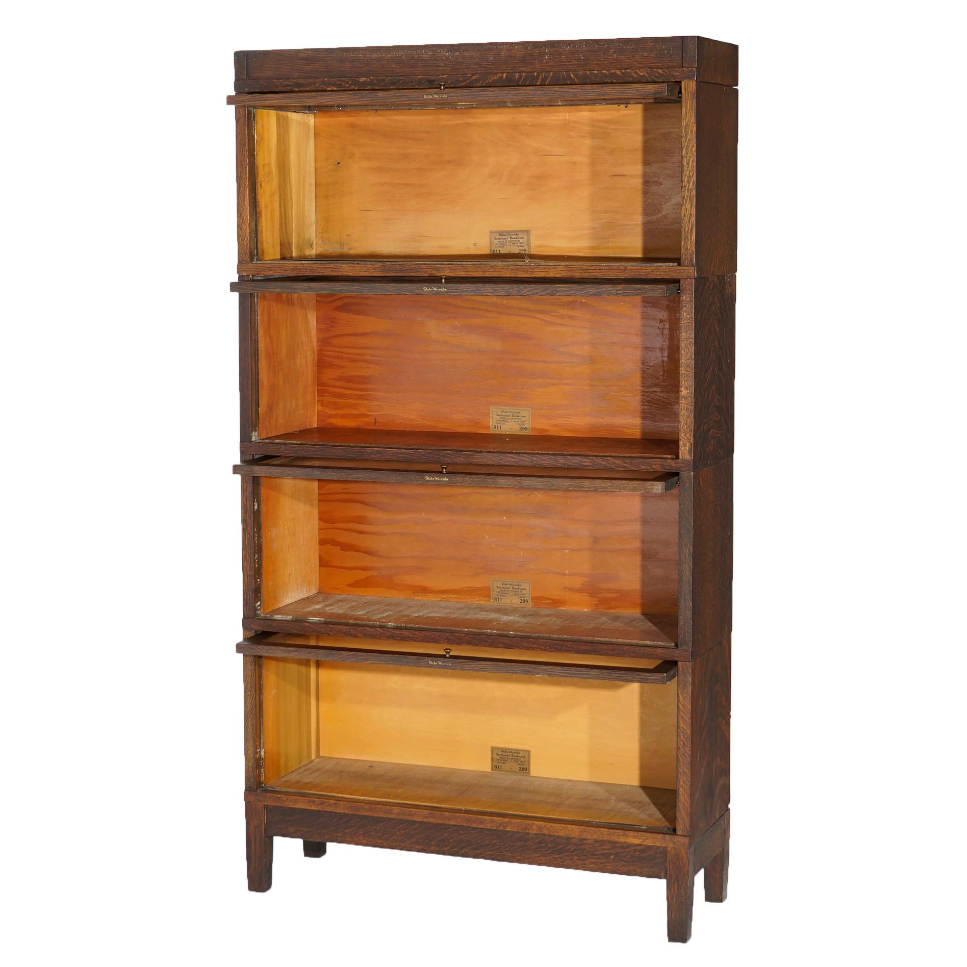 An antique Arts and Crafts barrister bookcase by Globe Wernicke offers quarter sawn oak construction with four stacks, each having pull-out glass doors, and raised on square and straight legs, maker label as photographed, c1910.

Measures- 62.75'' H