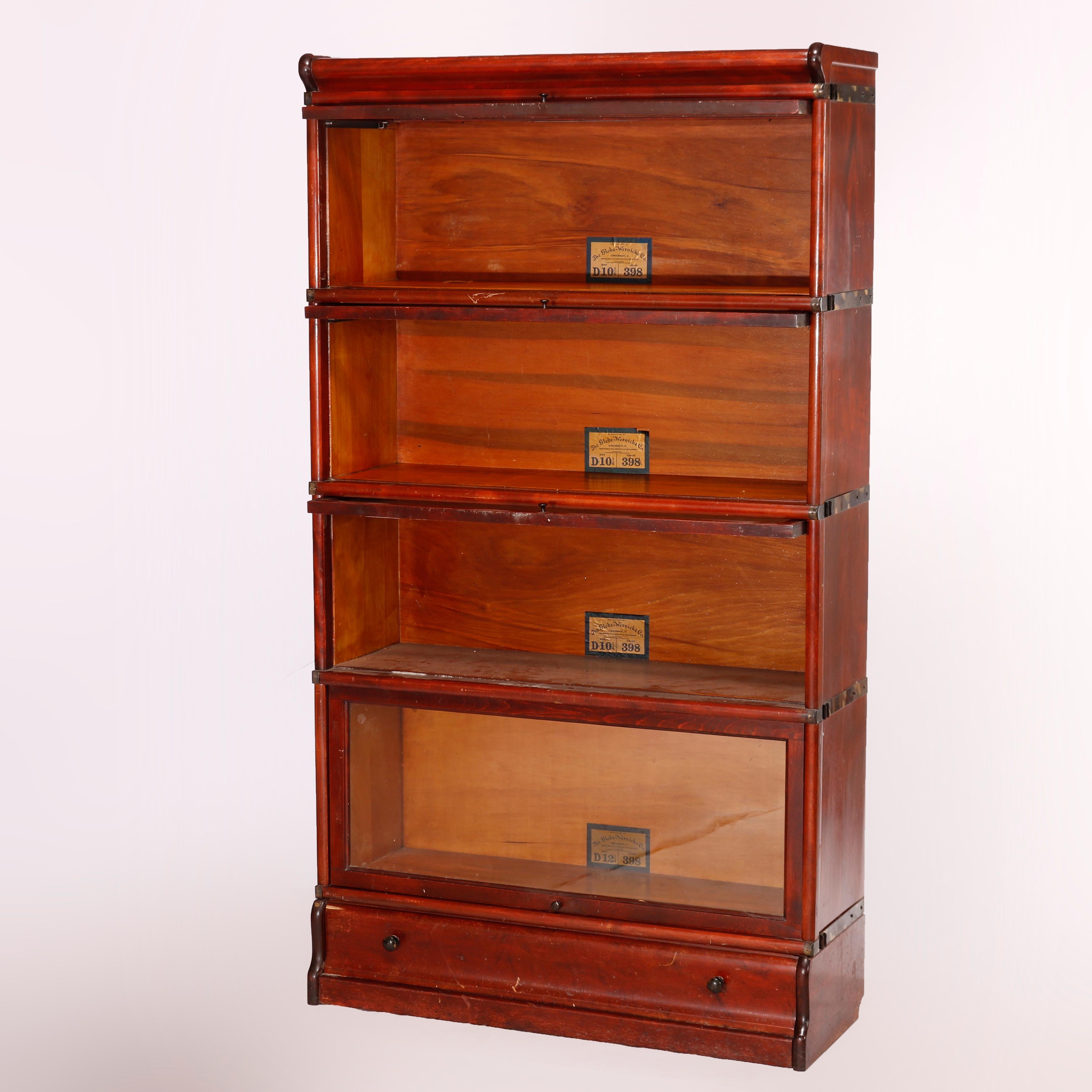 An antique Arts & Crafts barrister bookcase by Globe Wernicke offers mahogany construction with four stacks, each having pull out glass doors and seated on ogee base, maker label as photographed, c1910
 
Measures- 61.25''H X 34''W X 12.5''D; 1st