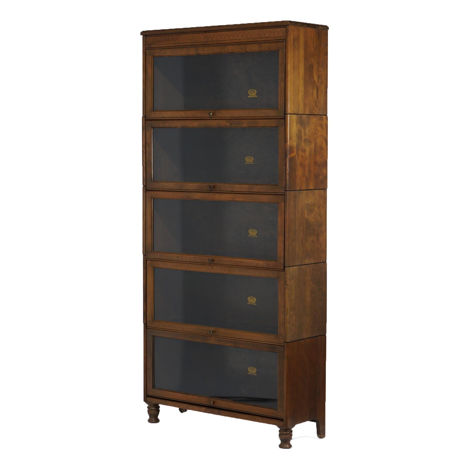 ***Ask About Reduced In-House Shipping Rates - Reliable Service & Fully Insured***
An antique Arts and Crafts barrister bookcase by Gunn offers cherry construction with five stacks, each having pullout glass doors, raised on straight legs and maker