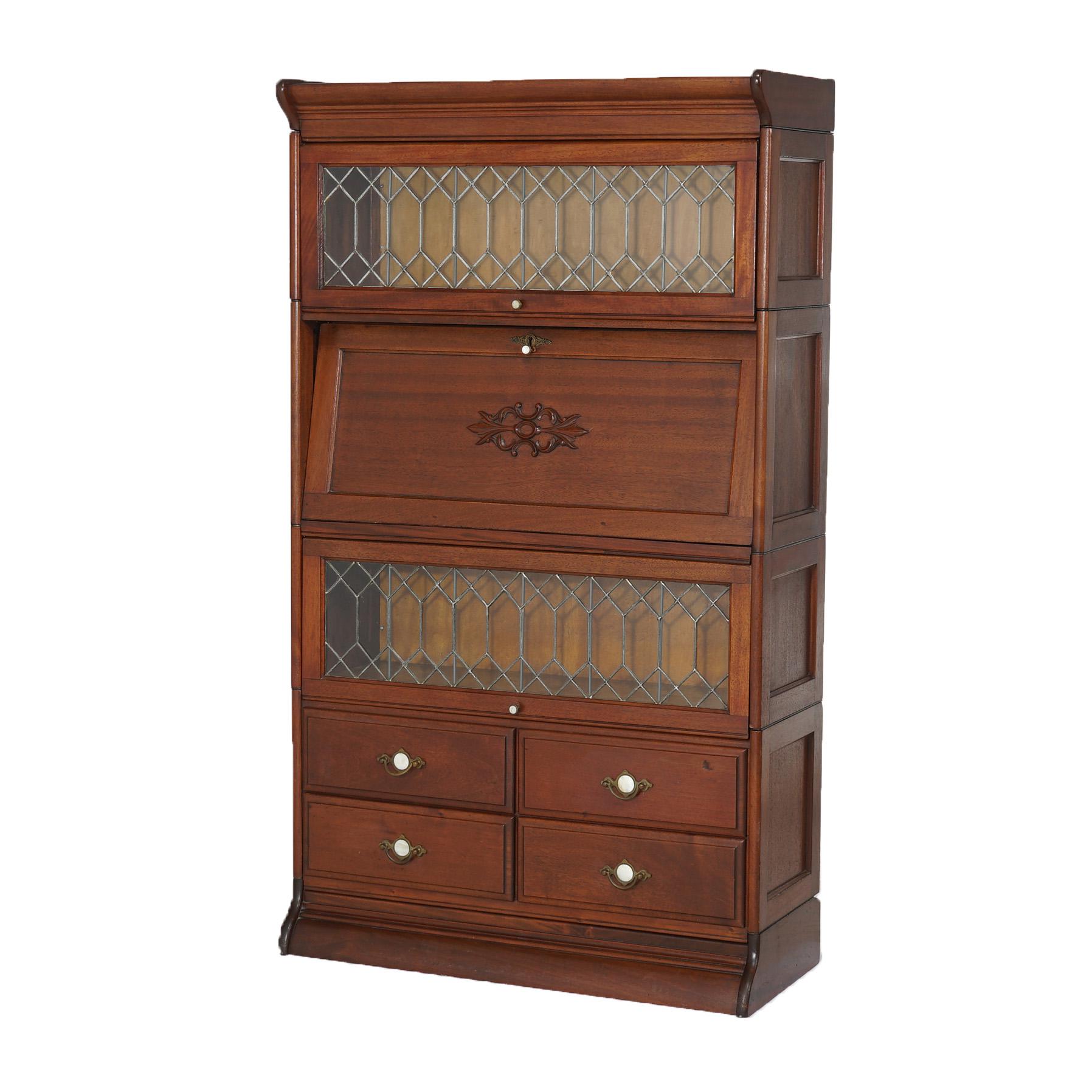 ***Ask About Reduced In-House Shipping Rates - Reliable Service & Fully Insured***
An antique Arts & Crafts barrister bookcase secretary by Gunn offers mahogany paneled construction with two stacks having pullout leaded glass doors, single stack