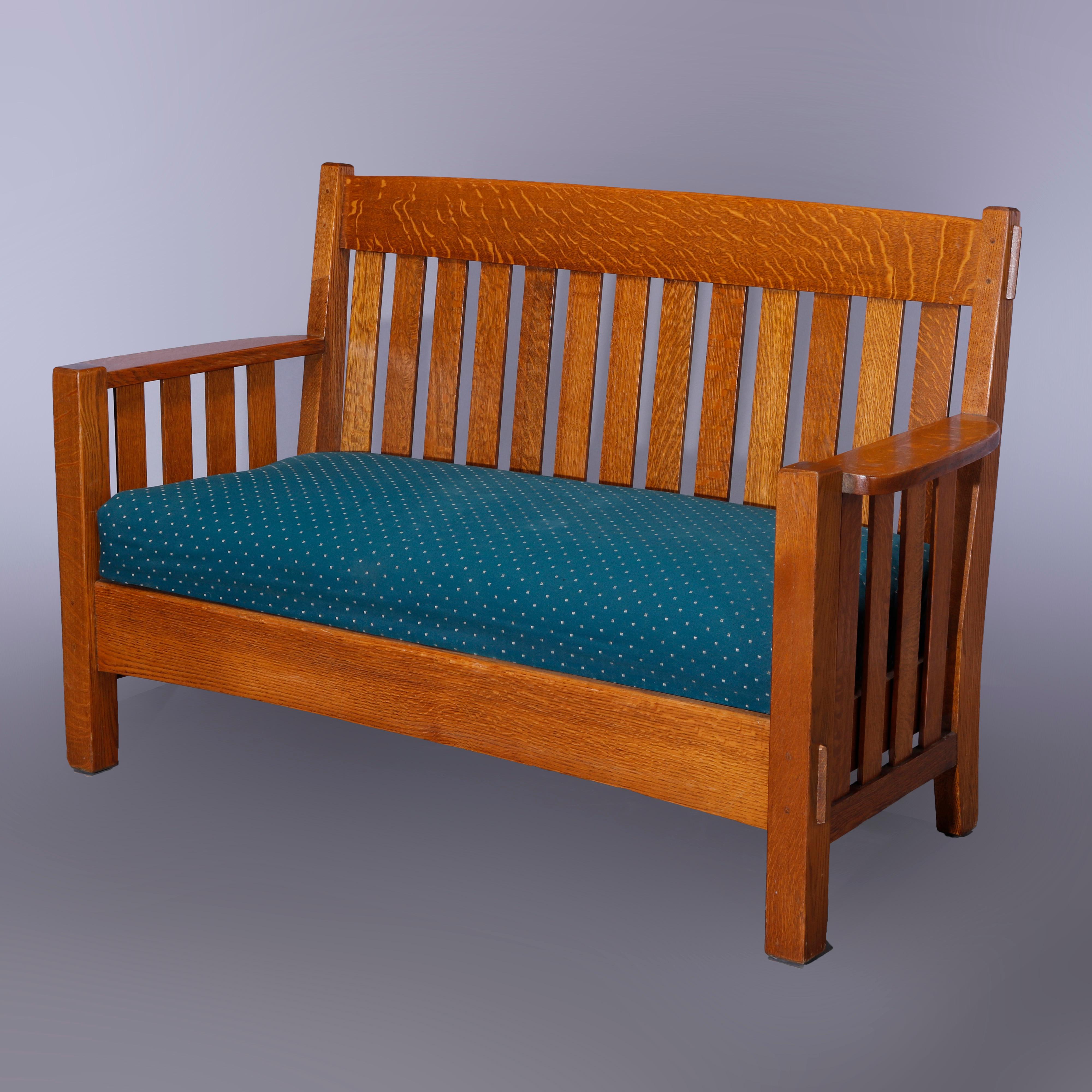 An antique Arts and Crafts Harden Mission oak settee offers slat back and sides with cushion seat, c1910

Measures - 38.25'' H x 60.5'' W x 26'' D.
   