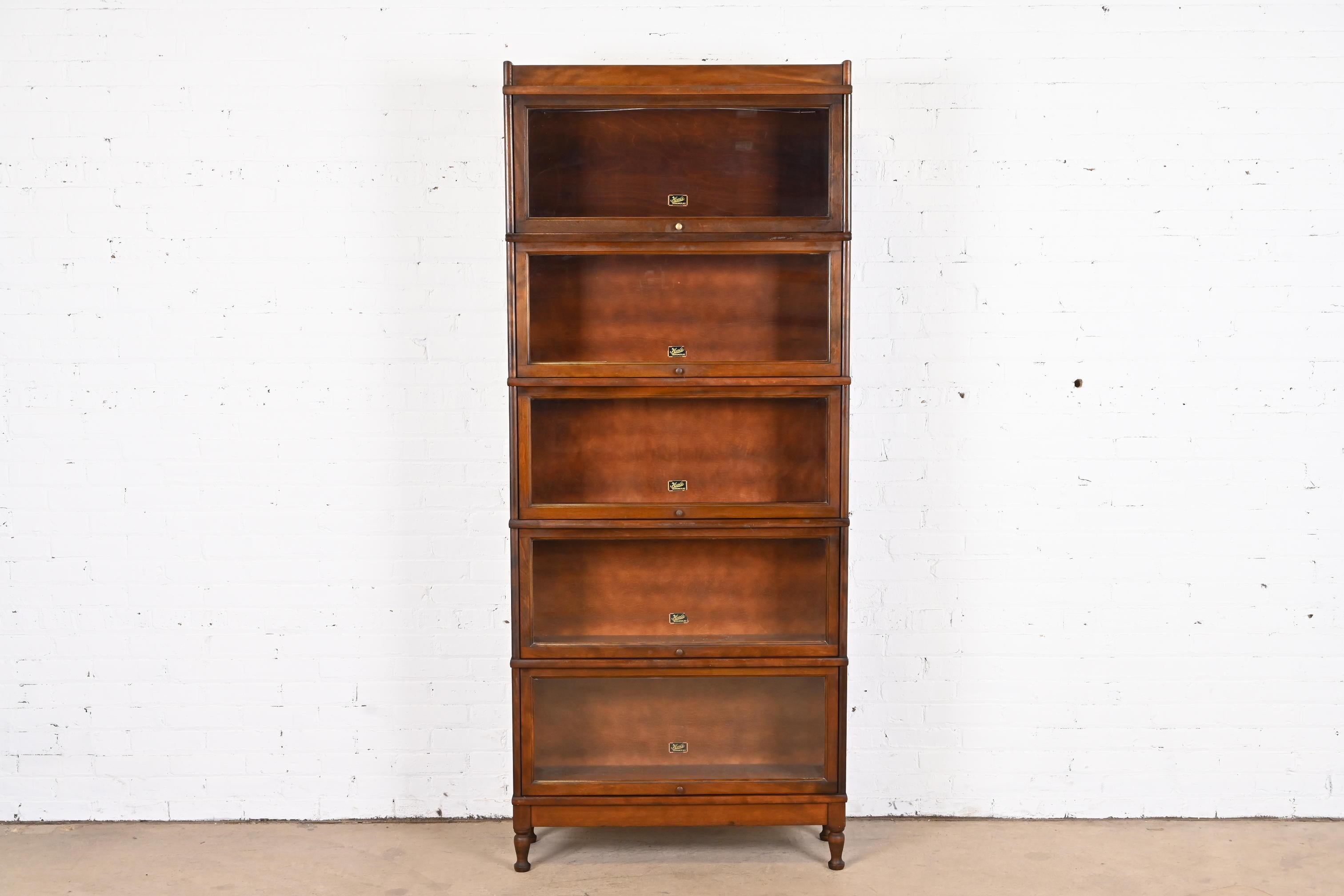 A gorgeous antique Arts & Crafts five-stack barrister bookcase

By Hale

USA, Circa 1920s

Mahogany, with glass front doors and brass hardware.

Measures: 34.25
