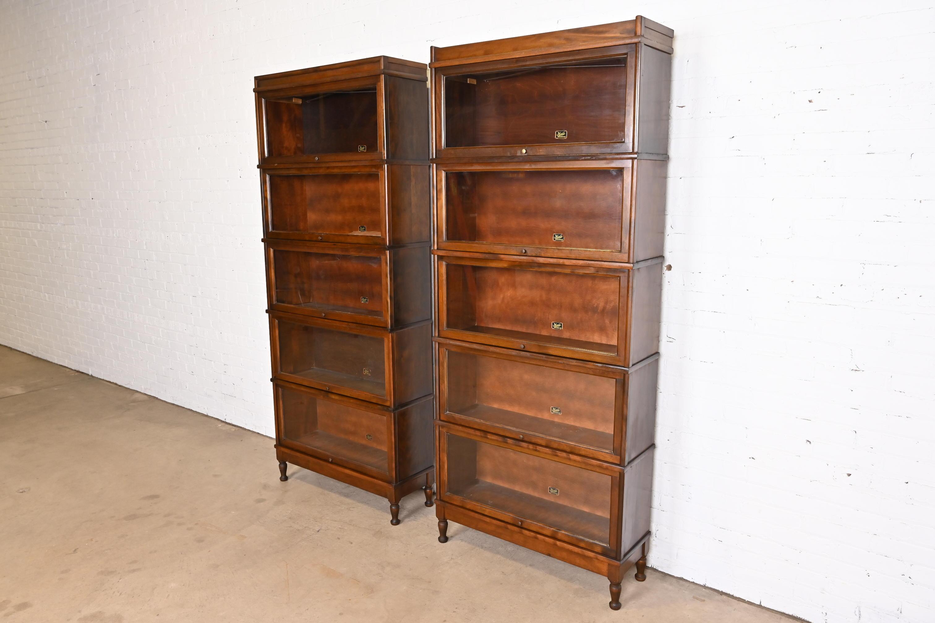 A gorgeous pair of antique Arts & Crafts five-stack barrister bookcases

By Hale

USA, Circa 1920s

Mahogany, with glass front doors and brass hardware.

Measures: 34.25