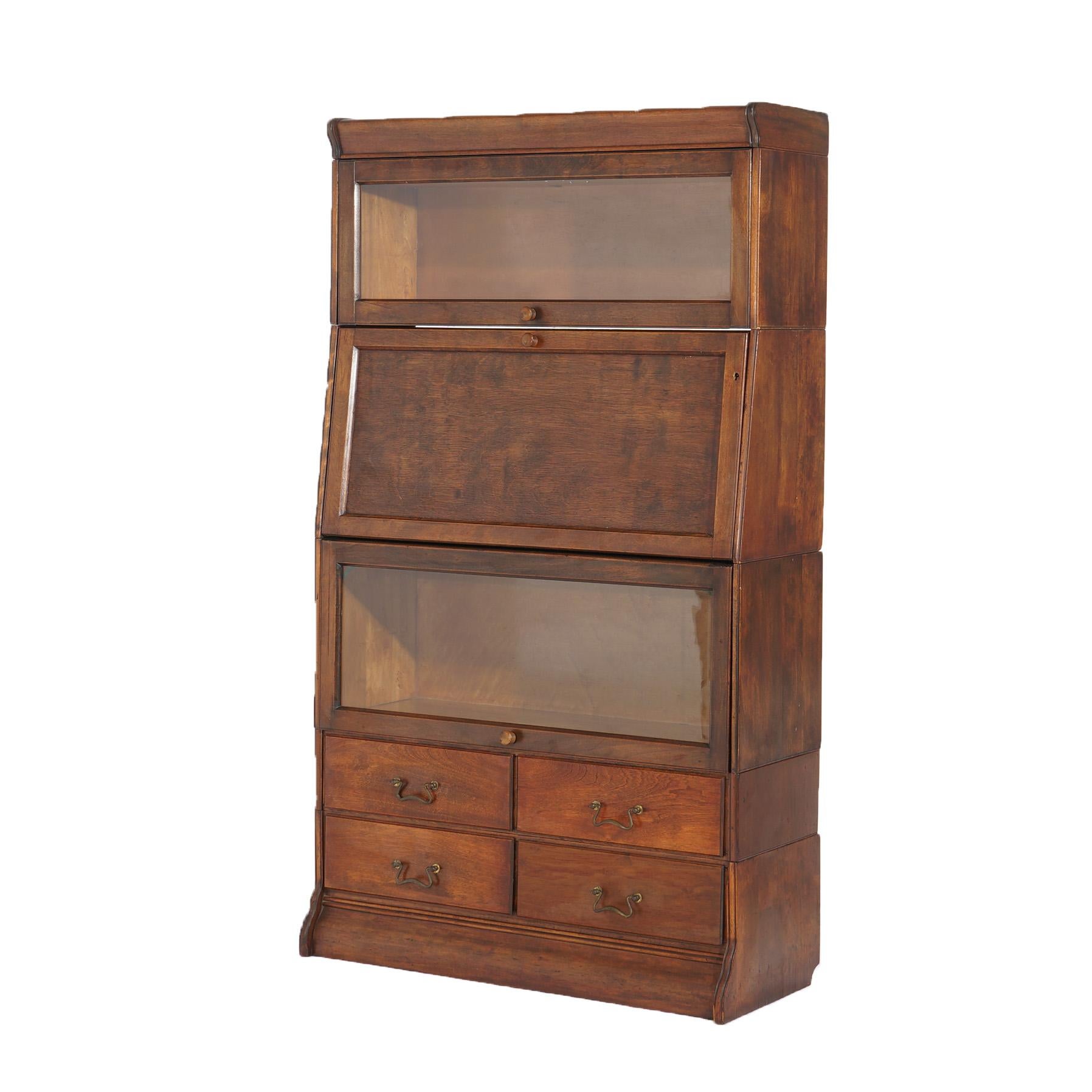 ***Ask About Discounted In-House Shipping***
An antique Arts and Crafts barrister bookcase offers mahogany construction with central secretary case having drop down desk, flanking bookcases having pull out glass doors and lower drawer unit,