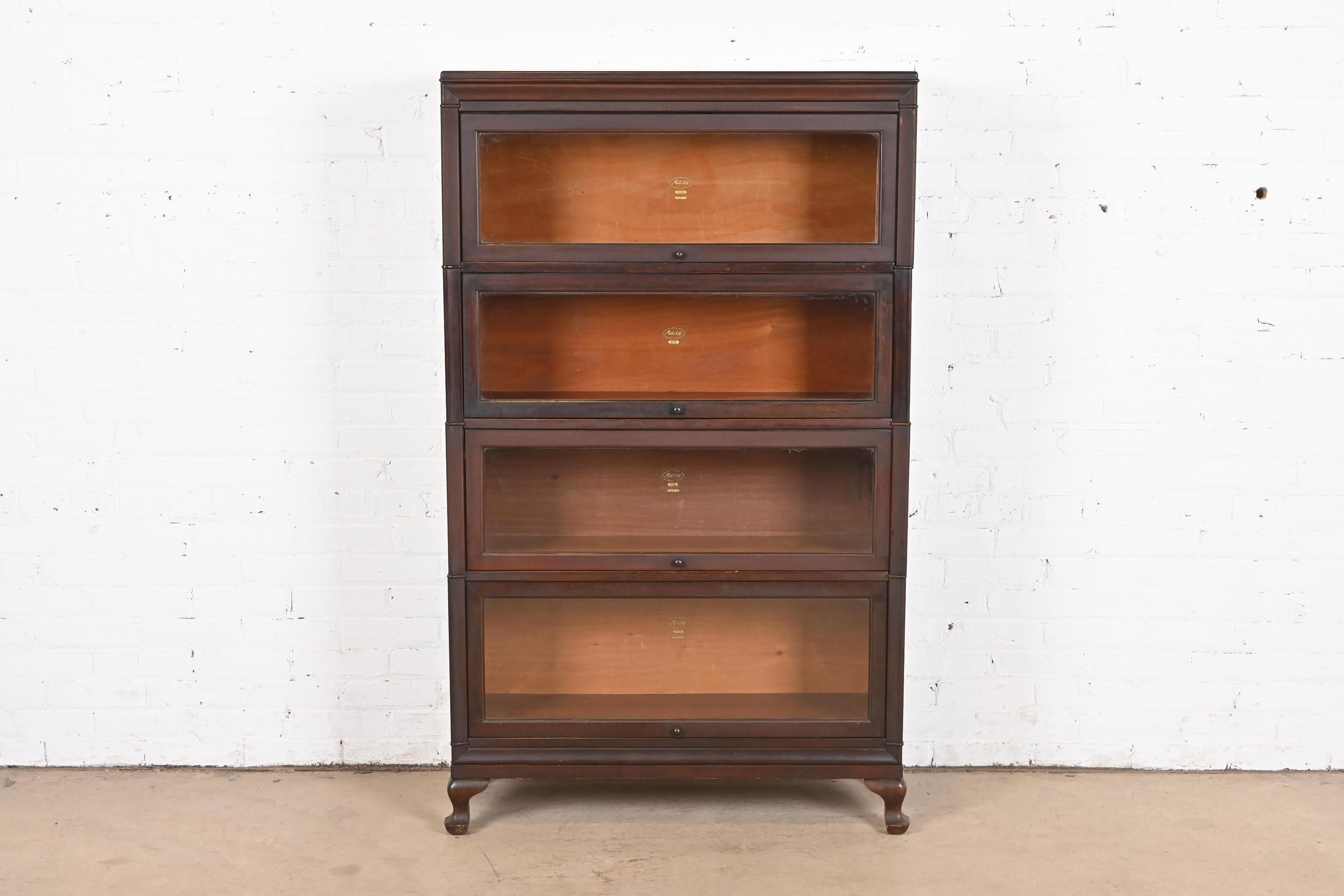 A gorgeous antique Arts & Crafts mahogany four-stack barrister bookcase

By Macey

USA, circa 1920s

Measures: 35.25