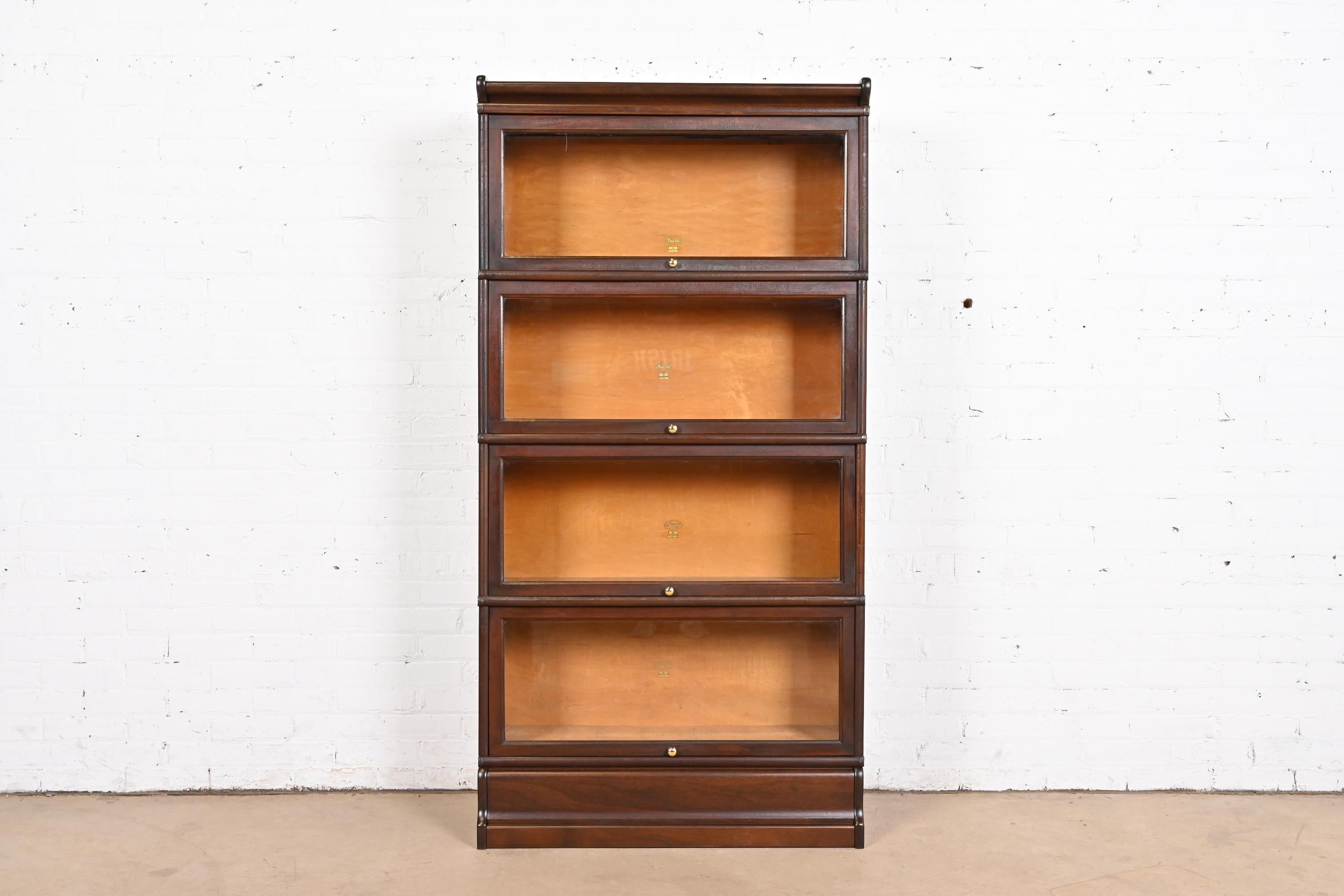 A gorgeous antique Arts & Crafts mahogany four-stack barrister bookcase

By Macey

USA, Circa 1920s

Measures: 34