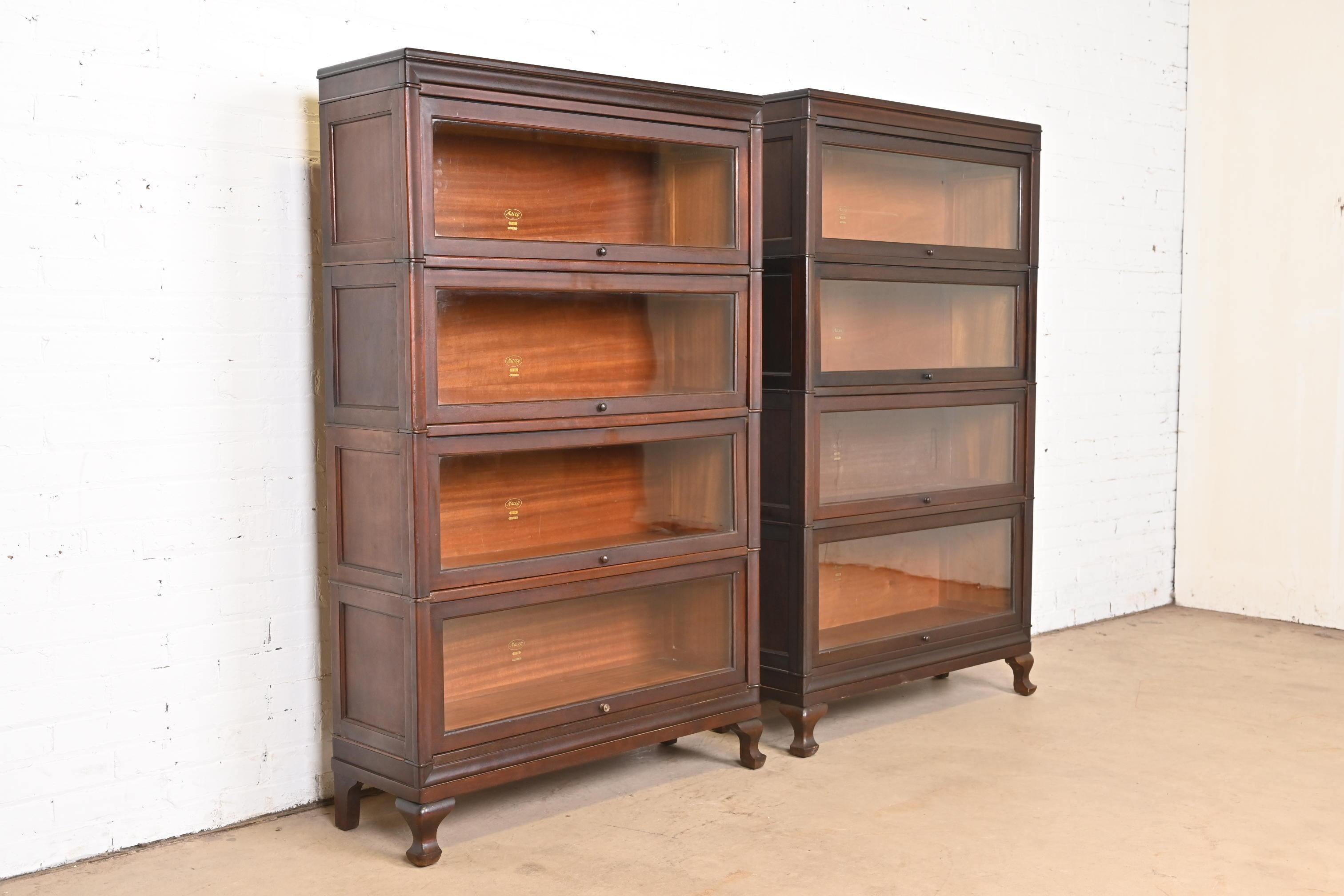 A gorgeous pair of Arts & Crafts antique mahogany four-stack barrister bookcases

By Macey

USA, circa 1920s

Measures: 
Bookcase #1: 35.25