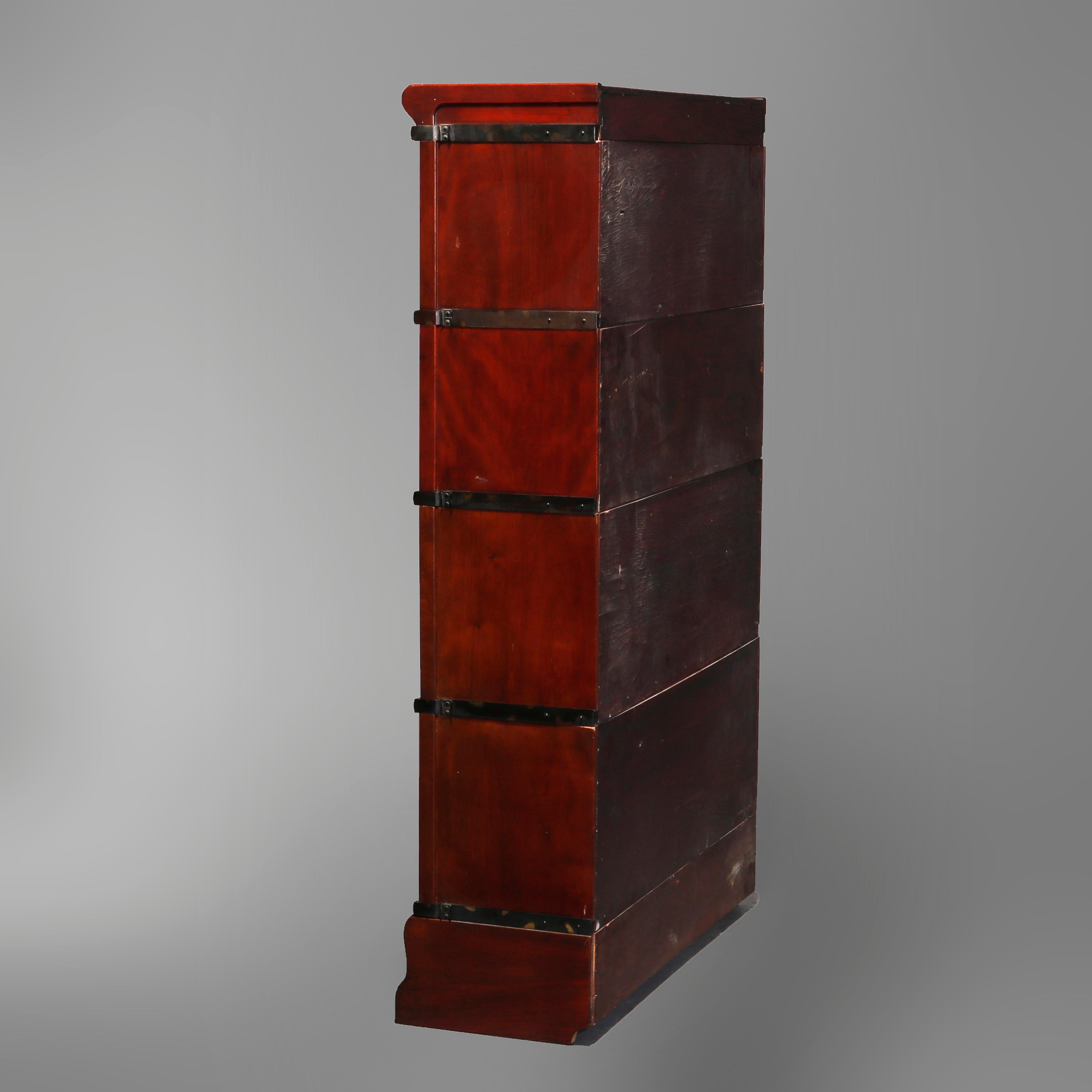 An antique Arts & Crafts mission barrister bookcase by Globe Wernicke offers mahogany construction with four stacks over lower drawer, original labels as photographed, circa 1910

Measures: 60.75