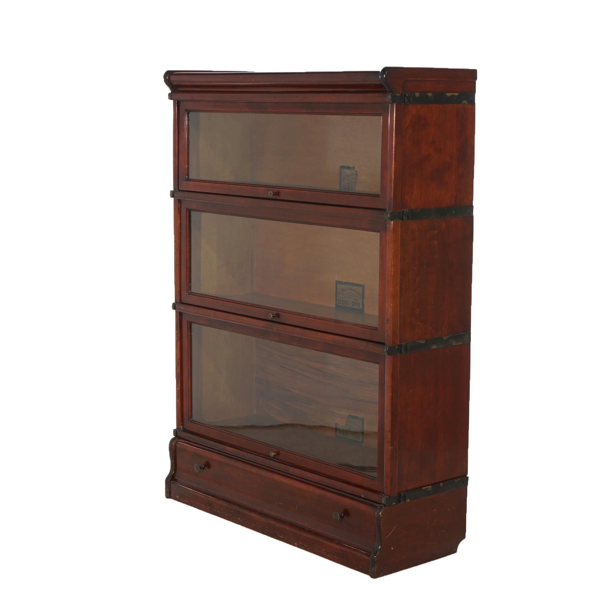 ***Ask About Reduced In-House Delivery Rates - Reliable Professional Service & Fully Insured***
An antique Arts and Crafts barrister bookcase by Globe Wernicke offers mahogany construction with three stacks, each having a pull out glass door, raised