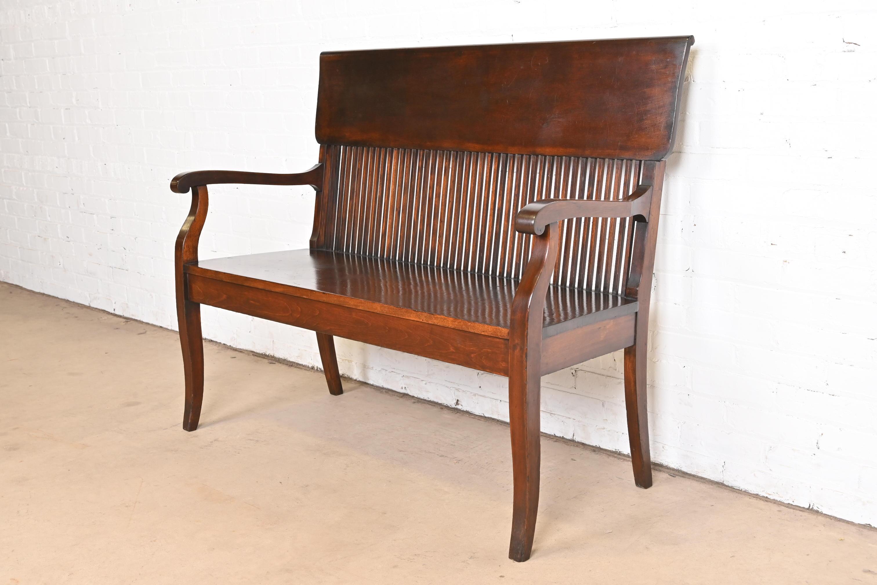 A beautiful Mission, Arts & Crafts, or Late Victorian mahogany banker or lawyer bench

USA, Circa 1900

Measures: 48.25