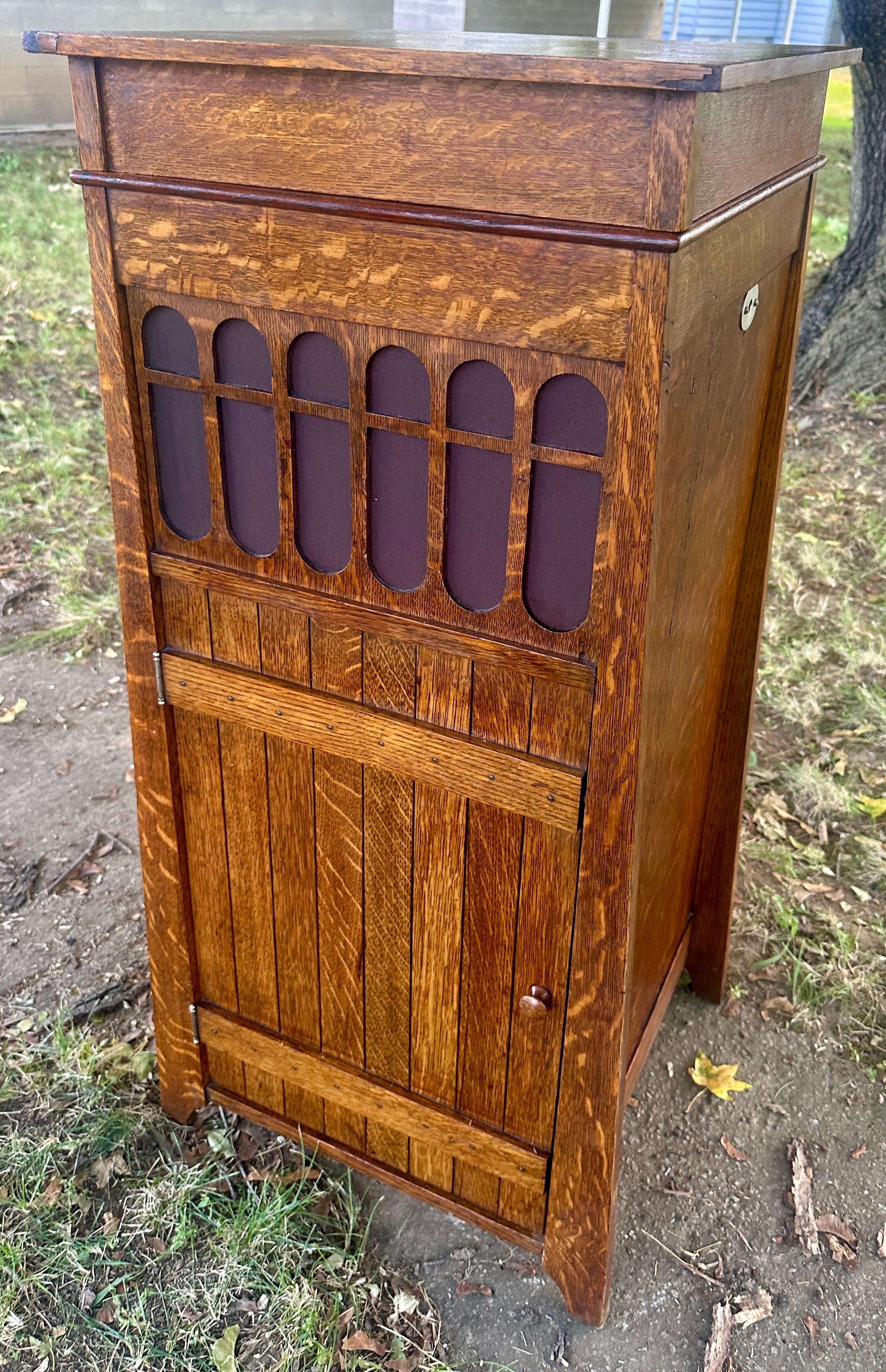 Antique Arts & Crafts Manual Turntable Cabinet (Roycroft?)

We purchased this item and found that it had a number of 
