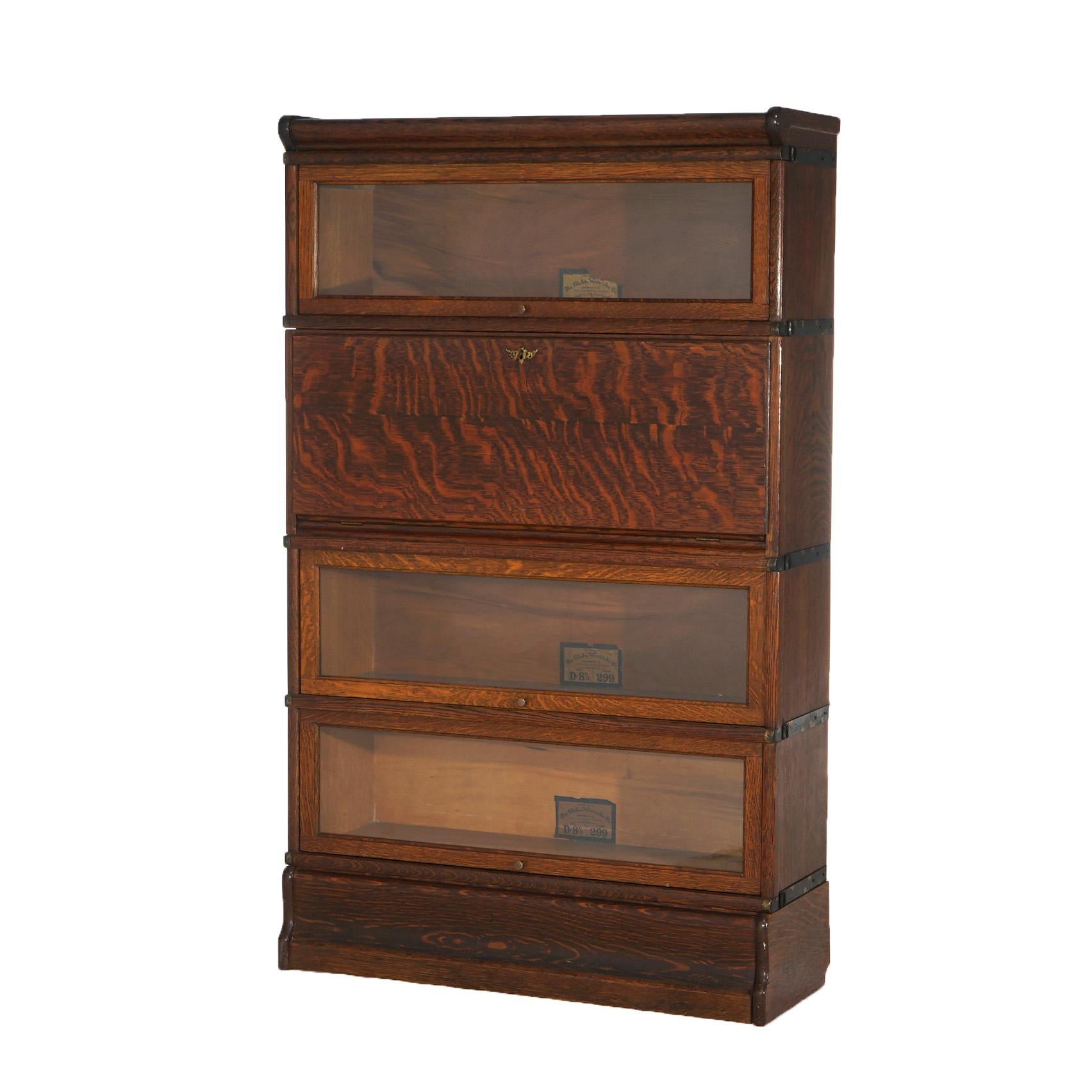 ***Ask About Reduced In-House Shipping Rates - Reliable Service & Fully Insured***
An antique Arts and Crafts Mission barrister bookcase by Globe Wernicke offers quarter sawn oak construction with three stacks having pullout glass doors, one stack