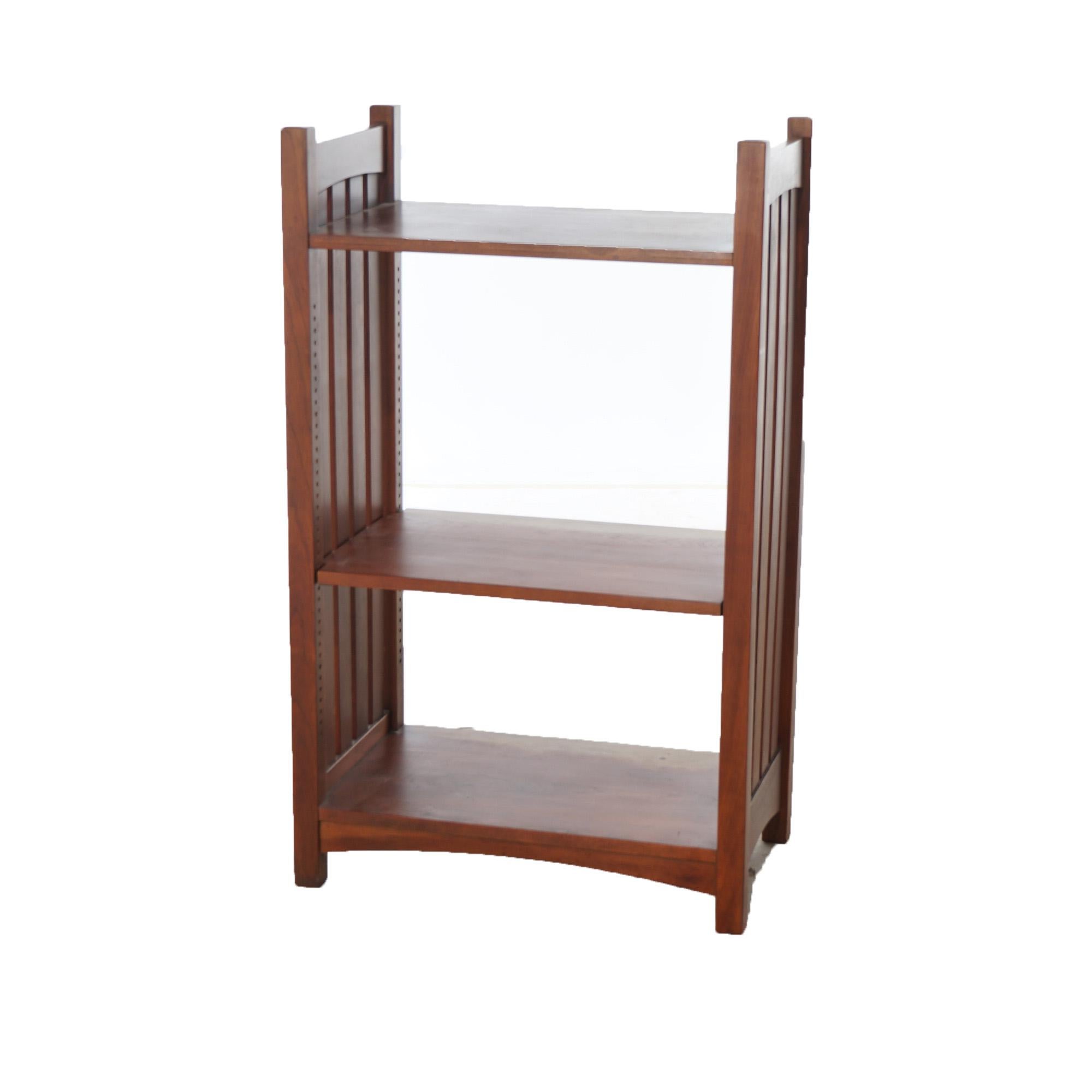 An Arts and Crafts Mission magazine stand offers mahogany construction with slat sides and three shelves, 20th century
Measures - 41