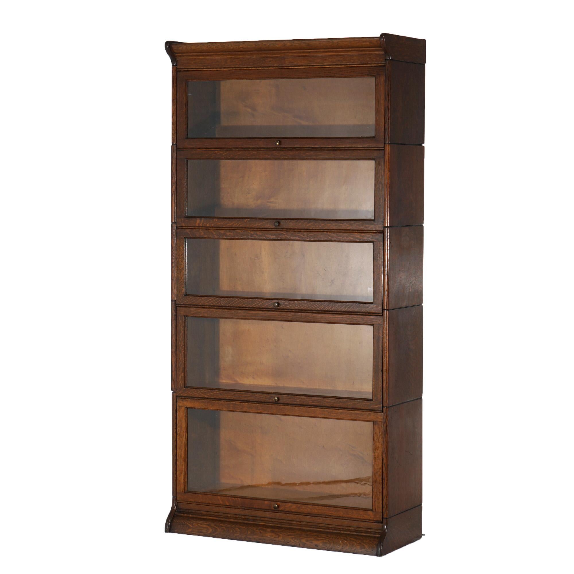 ***Ask About Reduced In-House Shipping Rates - Reliable Service & Fully Insured***

An antique Arts and Crafts Mission barrister bookcase offers quarter sawn oak construction with five stacks, each having pull-out glass doors, raised on ogee base,