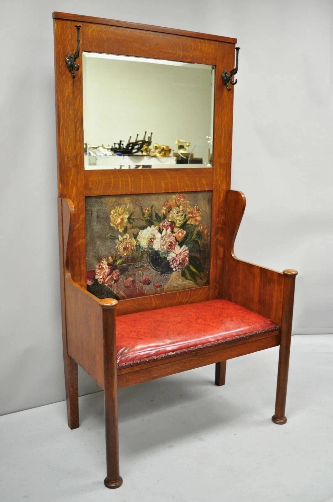 Antique Arts & Crafts Mission Oak Hand Painted Hall Bench Coat Rack w/ Mirror. Item features a tall impressive size, beveled glass mirror, hand painted floral scene, 2 coat hooks, removable red vinyl seat, very nice antique item. Circa Early 20th