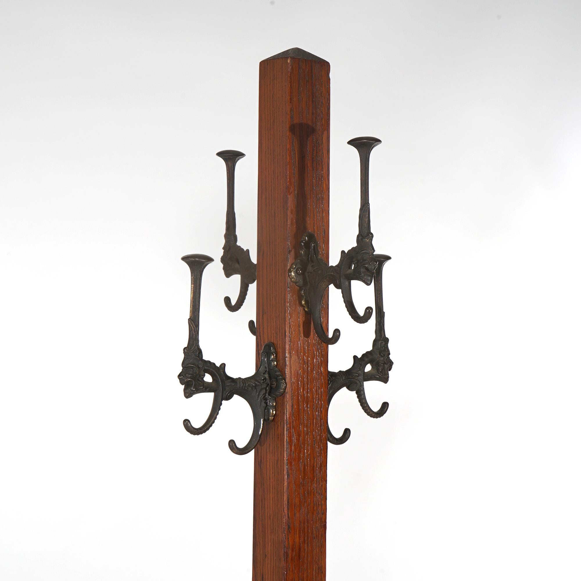 Antique Arts & Crafts Mission Oak Hat Tree with Figural Gargoyle Form Cast Iron Hooks, c1920

Measures - 73.5
