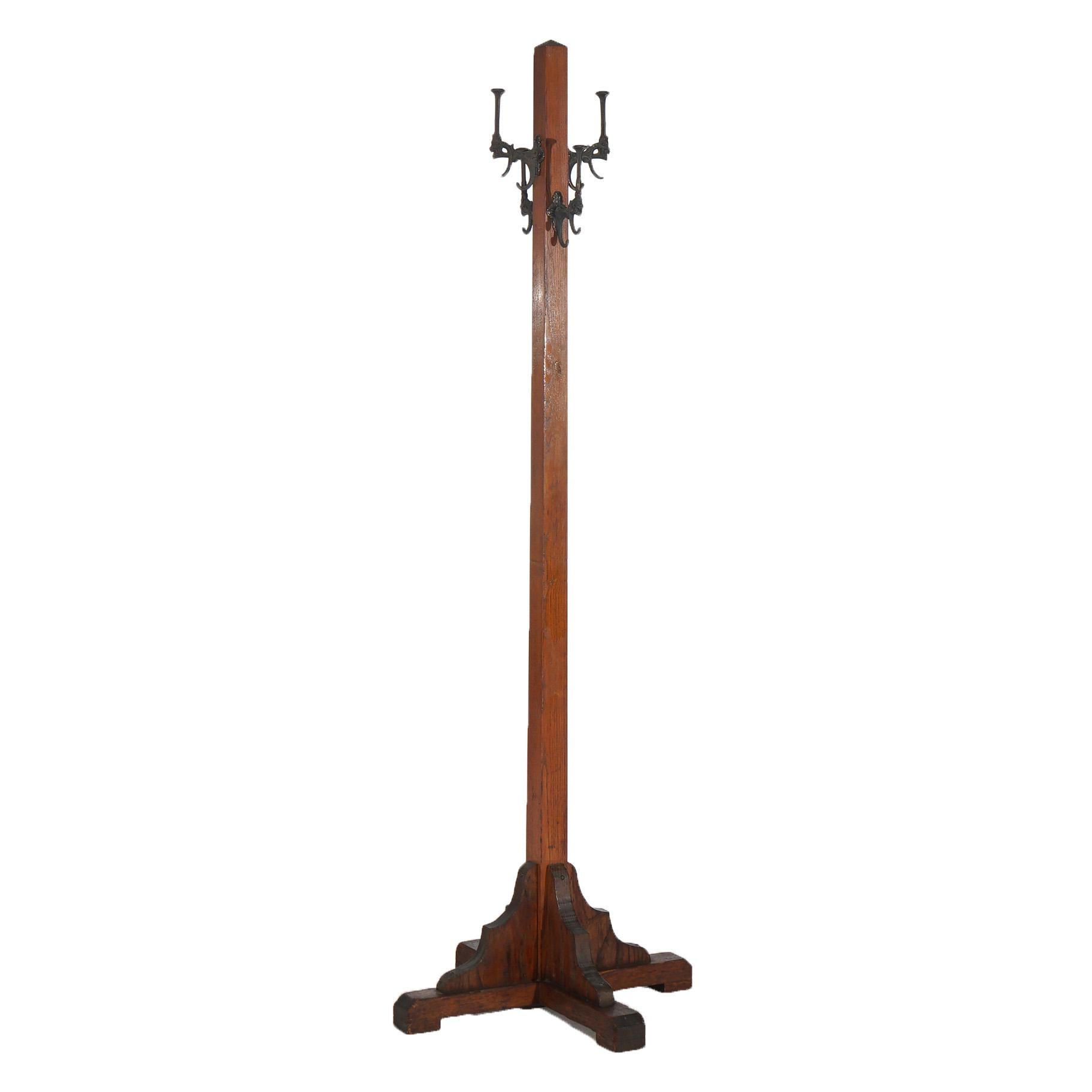Antique Arts & Crafts Mission Oak Hat Tree with Gargoyle Form Cast Iron Hooks In Good Condition In Big Flats, NY