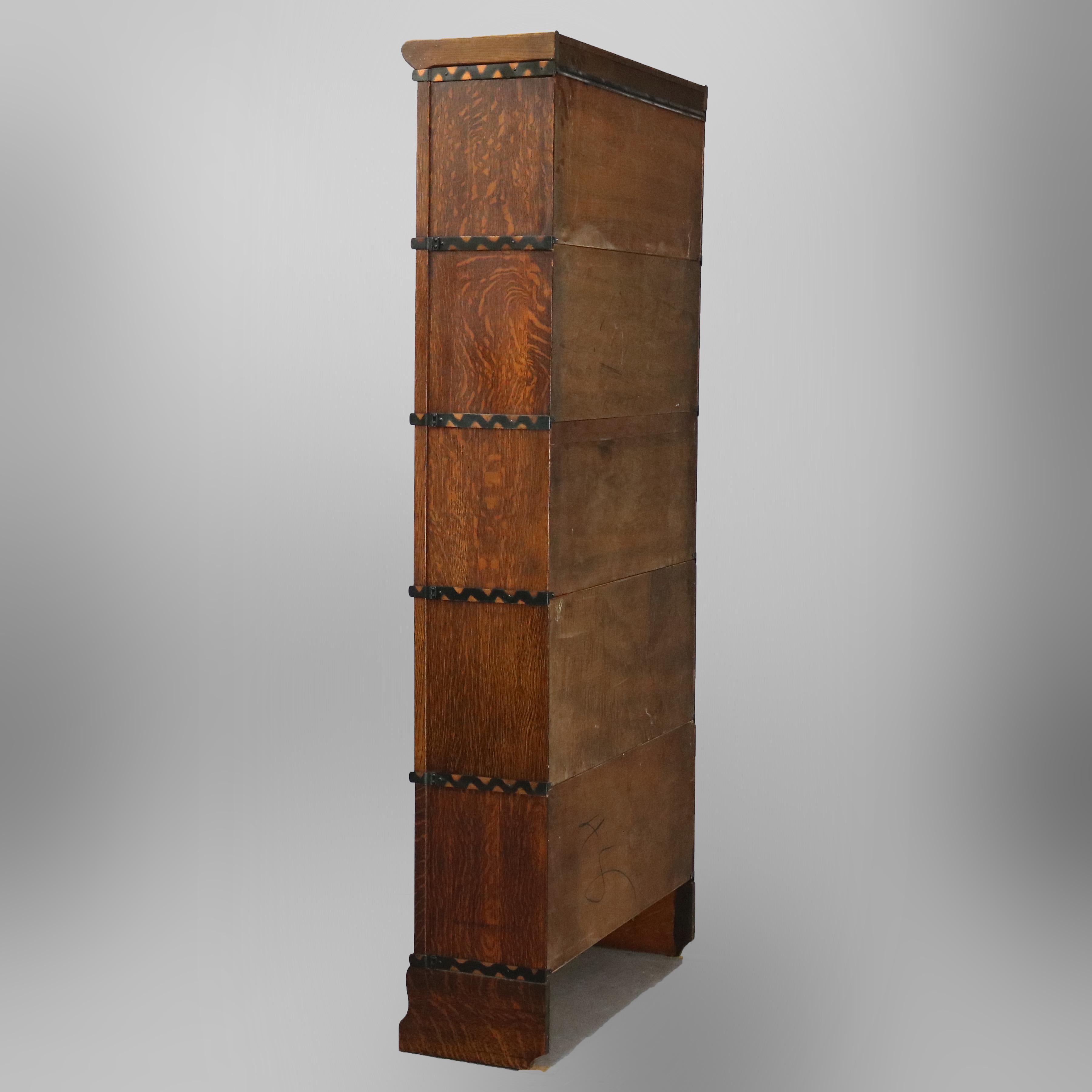 An antique Arts & Crafts Mission Barrister stacking bookcase by Macey offers quarter sawn oak construction with five sections having pull-out glass doors, original labels as photographed, circa 1910.

Measures: 77.25