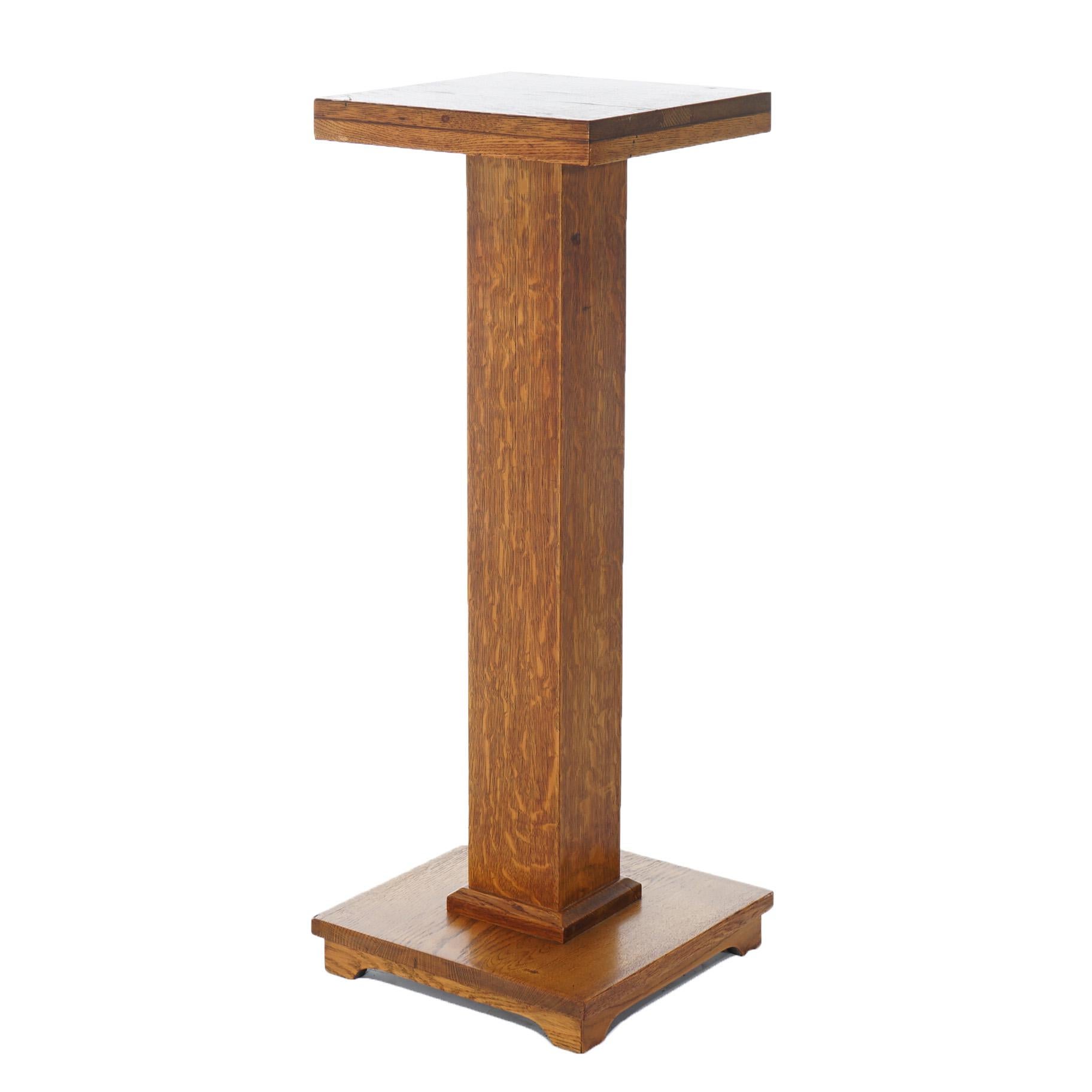 An antique Arts and Crafts Mission plant stand offers quarter sawn oak construction with square display and footed base, c1910

Measures- 36.75''H x 14''W x 14''D 