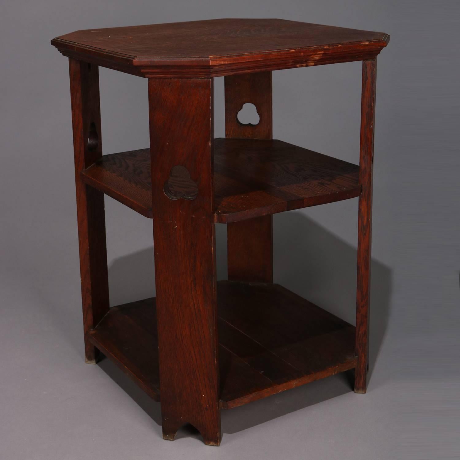 Antique Arts & Crafts Mission oak lamp or plant stand features quarter sawn oak construction with three tiers and cutout trefoils in legs, circa 1910

Measures: 27.5