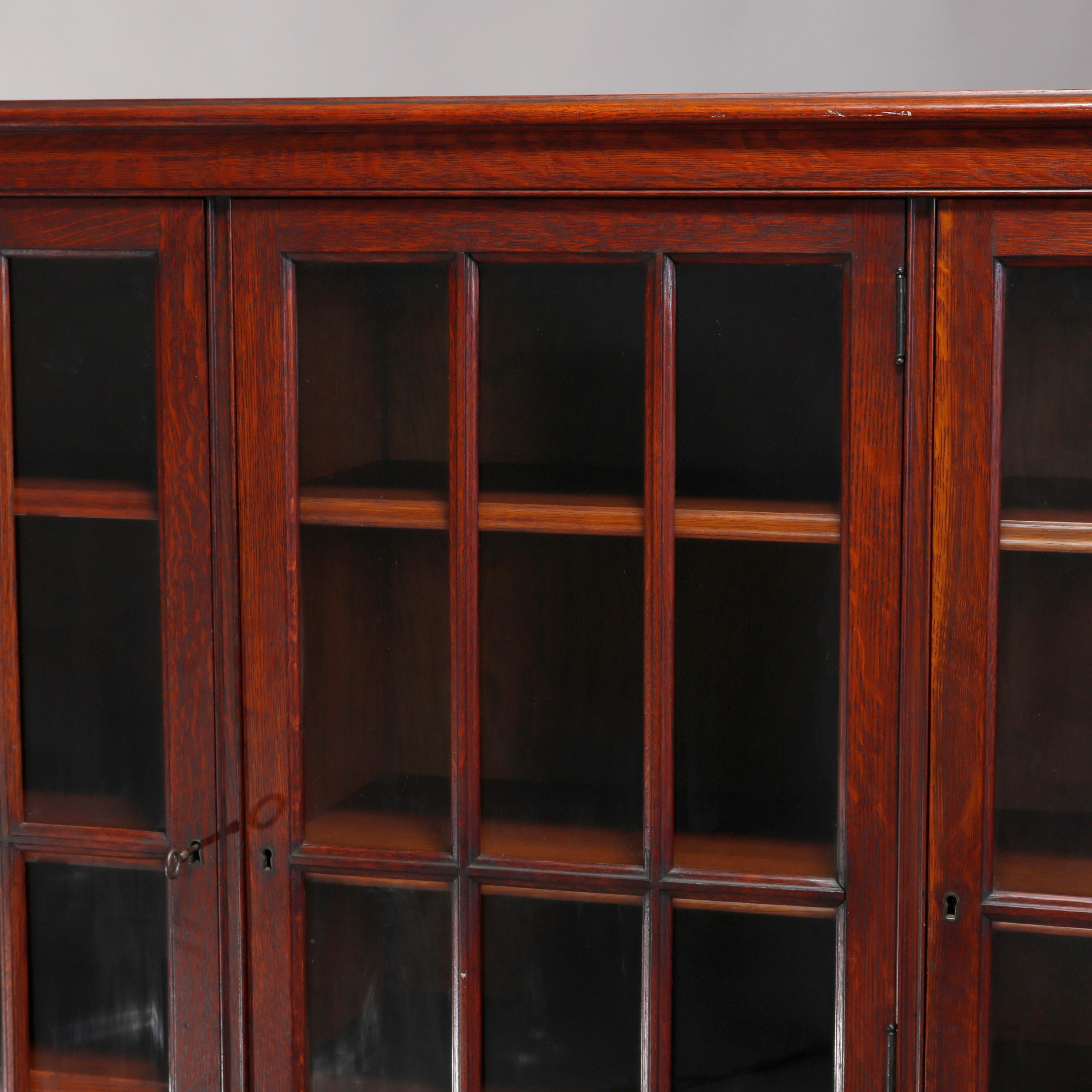 Carved Antique Arts & Crafts Mission Style Oak Three-Door Bookcase, circa 1910