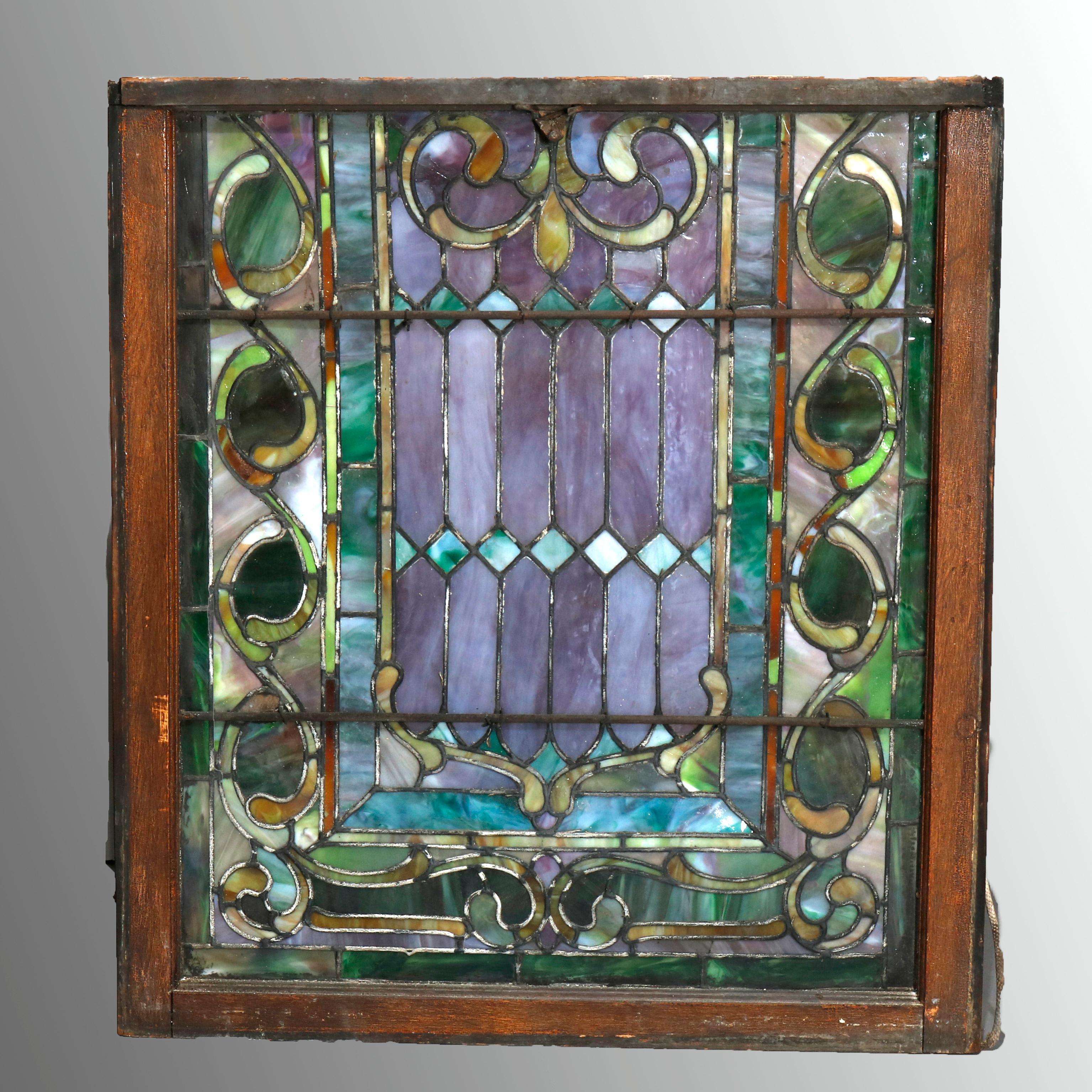 An antique Arts & Crafts mosaic window offers leaded slag glass in scroll and foliate pattern, seated in original sash, circa 1930.

***DELIVERY NOTICE – Due to COVID-19 we are employing NO-CONTACT PRACTICES in the transfer of purchased items. 