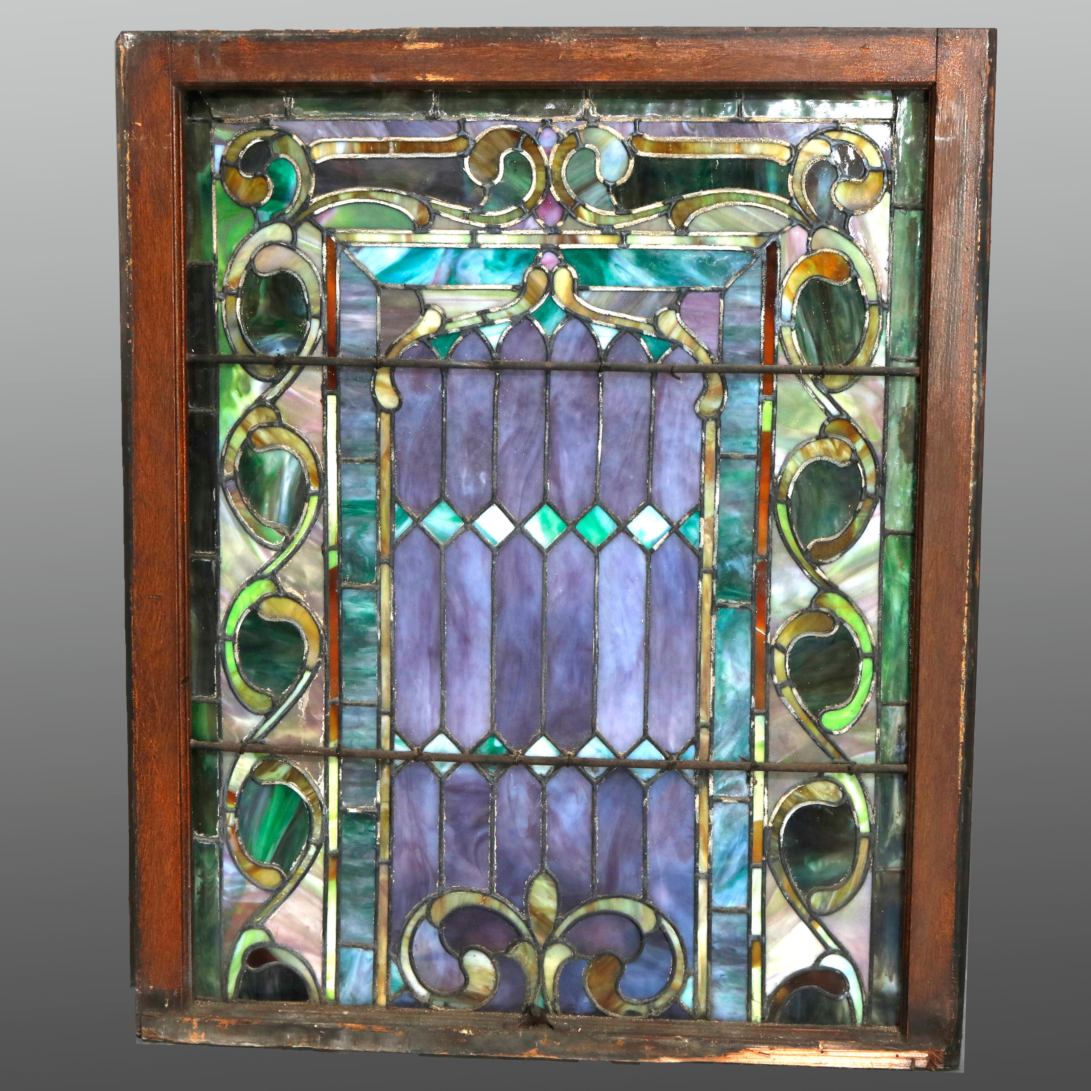 An antique Arts & Crafts mosaic window offers leaded slag glass in scroll and foliate pattern, seated in original sash, circa 1930

***DELIVERY NOTICE – Due to COVID-19 we are employing NO-CONTACT PRACTICES in the transfer of purchased items. 