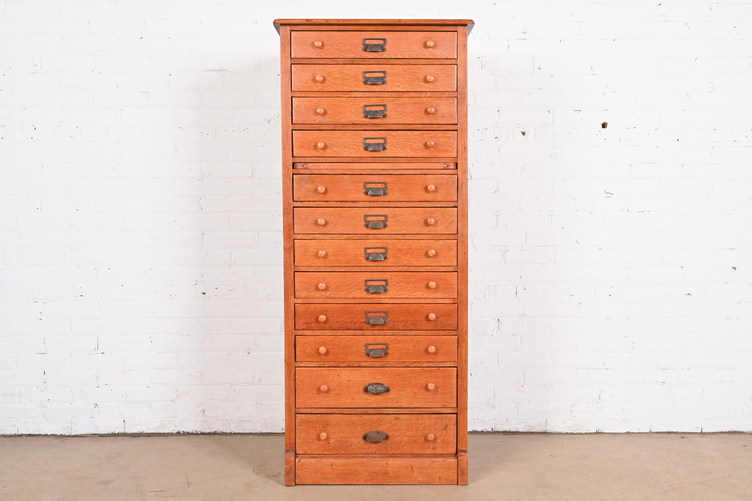 A rare antique Arts & Crafts or Late Victorian 12-drawer flat file cabinet or chest of drawers

USA, Circa 1900

Solid quartersawn oak, with iron hardware.

Measures: 25.5