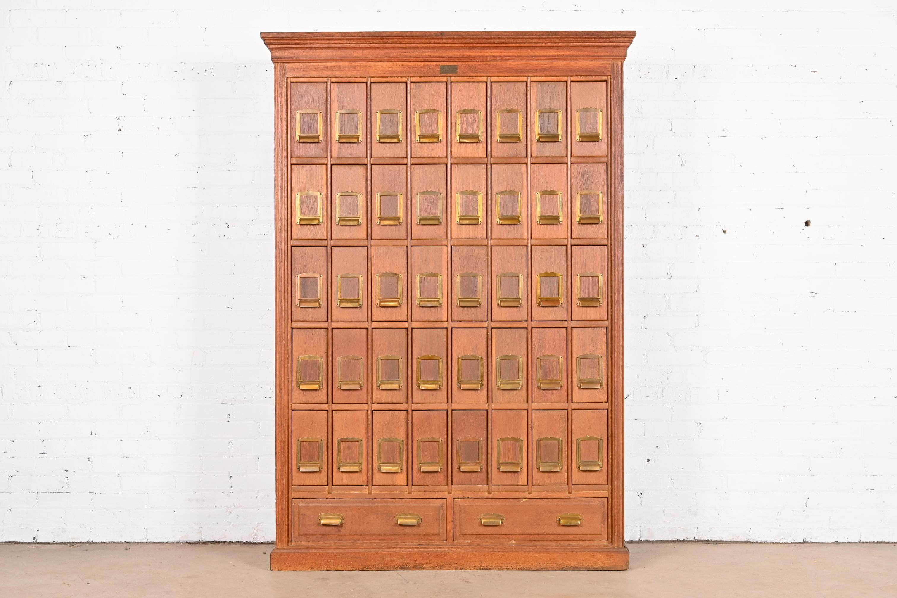 A rare antique Arts & Crafts card file cabinet 

By Clarke & Baker Co.

USA, Circa 1900

Solid oak, with original brass hardware. 

Measures: 51.25