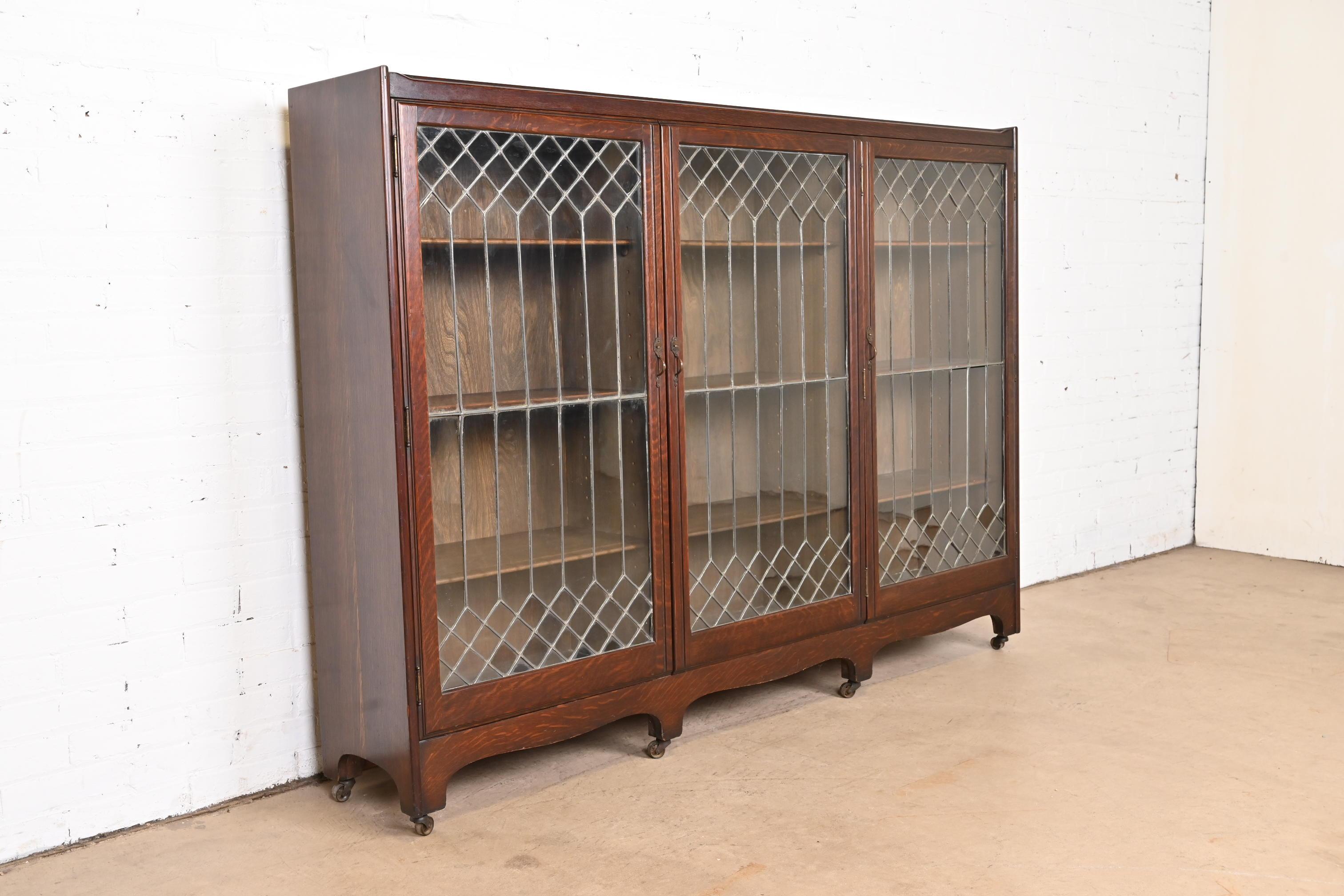 An exceptional antique Arts & Crafts or Mission triple bookcase

By George C. Flint Co.

New York, USA, Late 19th Century

Quarter sawn oak, with original leaded glass doors and brass hardware.

Measures: 69.75