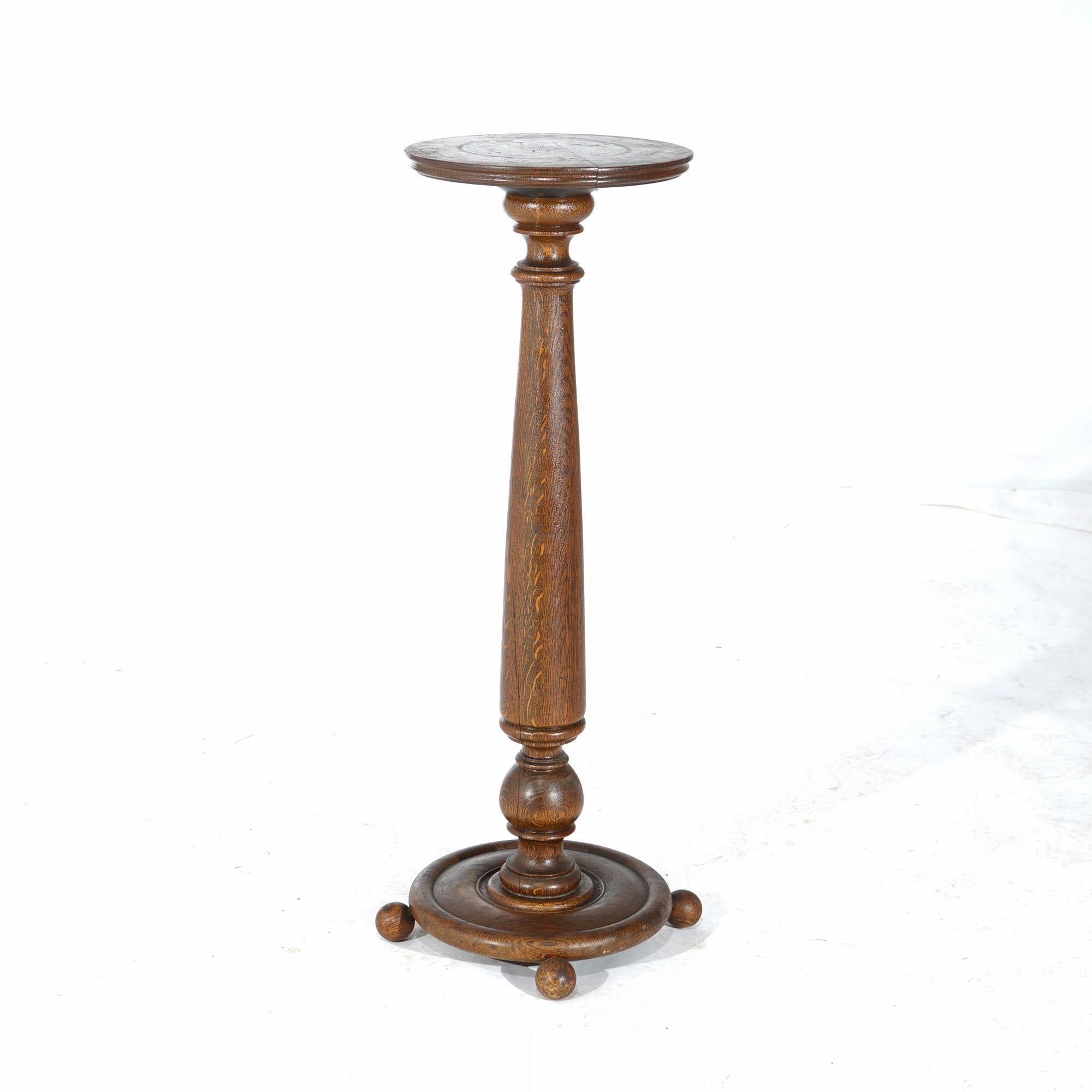 ***Ask About Discounted In-House Shipping***
An antique Arts and Crafts pedestal offers quarter sawn oak construction with circular display over turned and flared column, raised on circular base with ball feet, c1900

Measures - 35.5