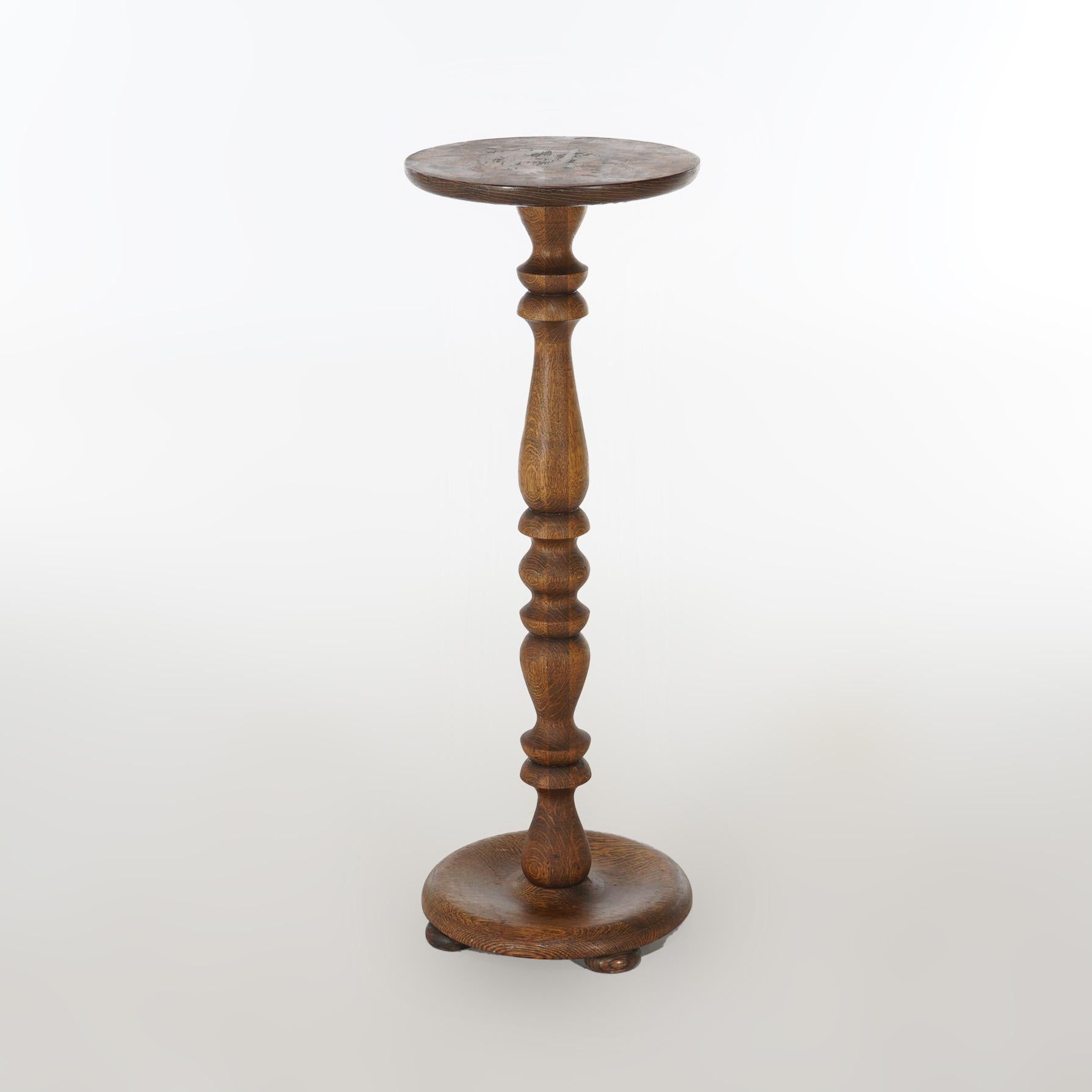 An antique Arts & Crafts plant stand offers oak construction with circular  display over turned balustrade form column on circular footed base, c1910

Measures - 34.5