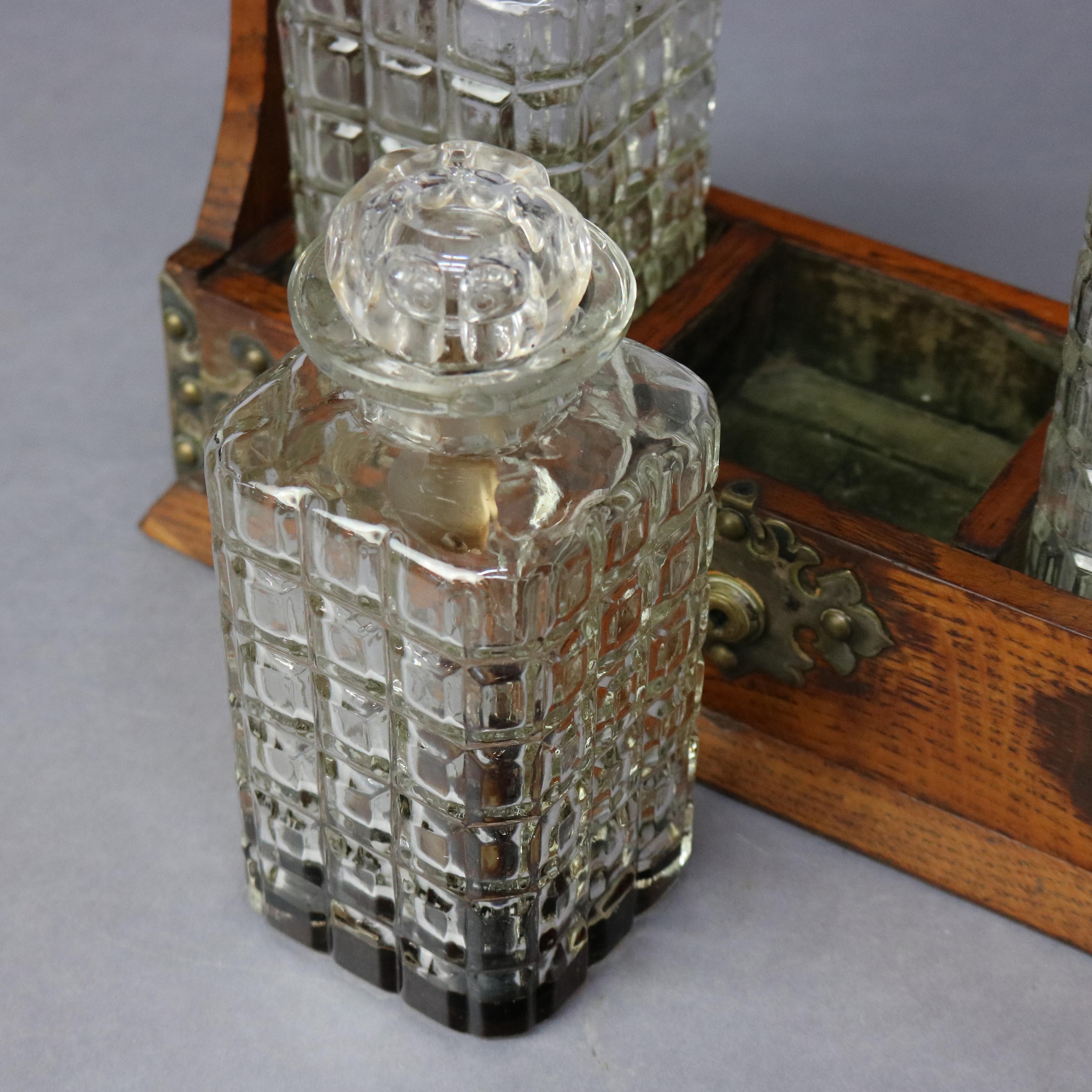 20th Century Antique Arts & Crafts Oak Tantalus Set with Three Decanters, circa 1900