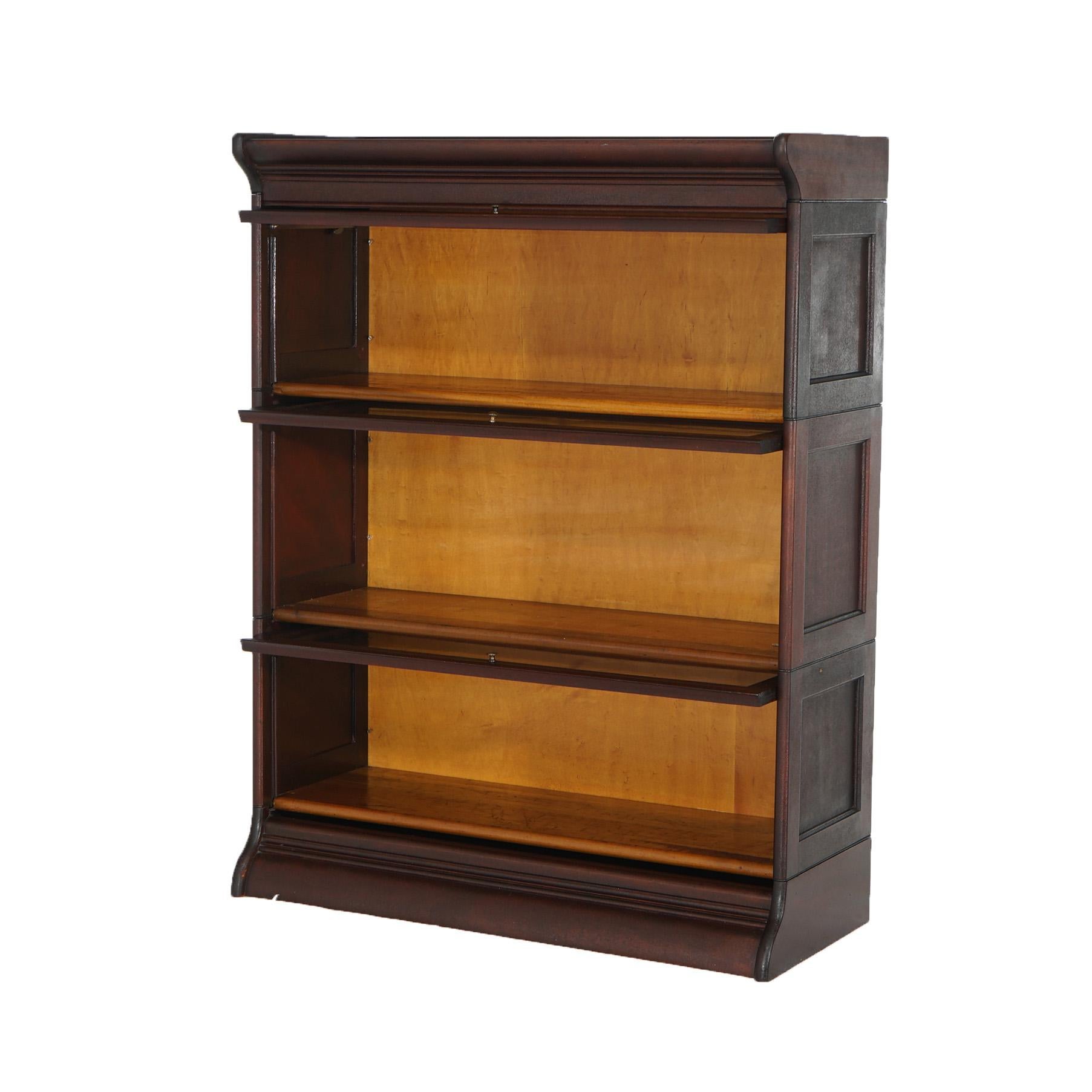 An antique Arts and Crafts 76624 barrister bookcase offers paneled oak construction with three stacks, each having pullout glass doors and raised on ogee base, c1930

Measures- overall 43''H x 33.75''W x 12.5''D; shelves 9.25''H x 31.75''W x 8.25''D