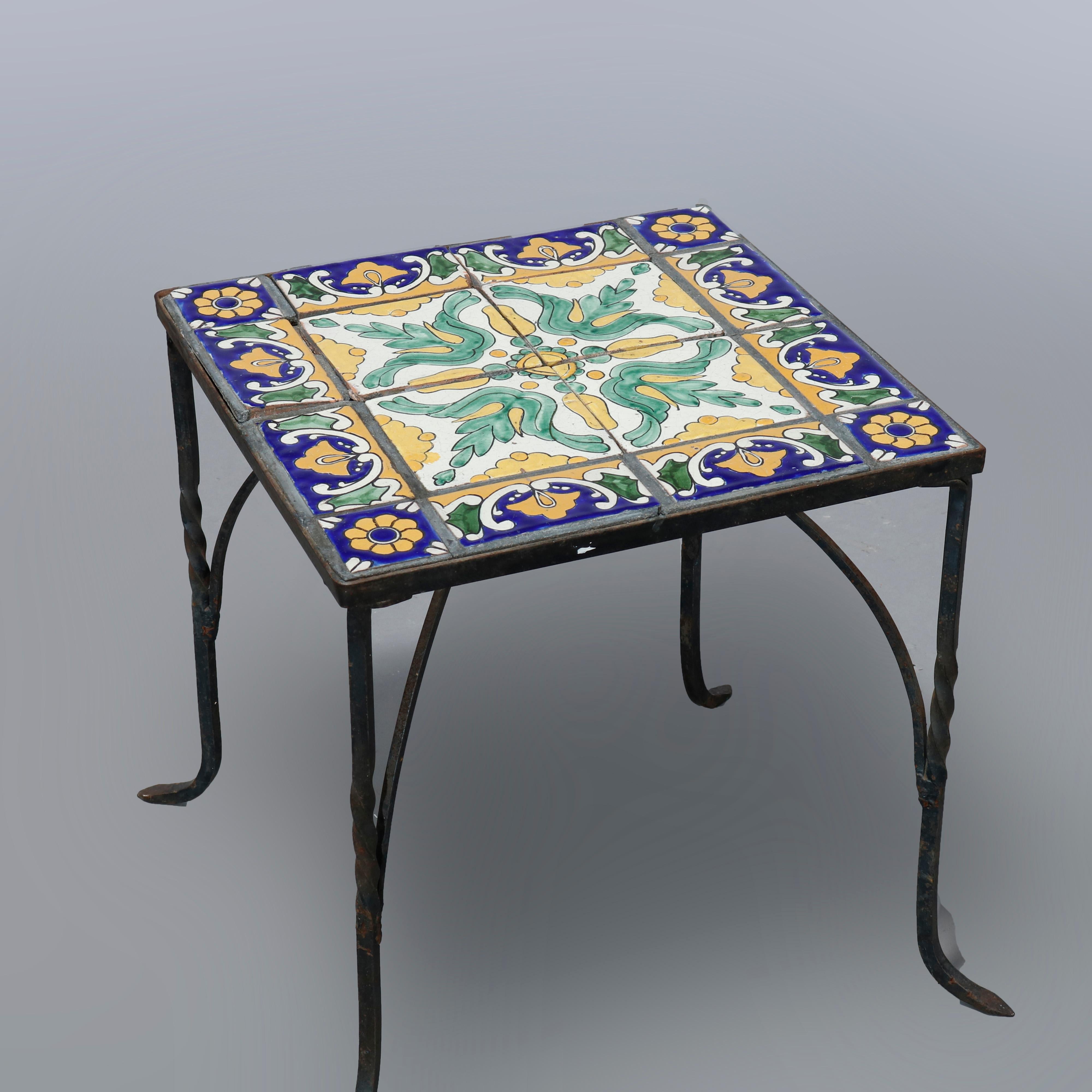 An antique Arts and Crafts side table in the manner of Oscar Bach offers tile top over wrought iron base having twist legs, c1930

Measures: 19.25