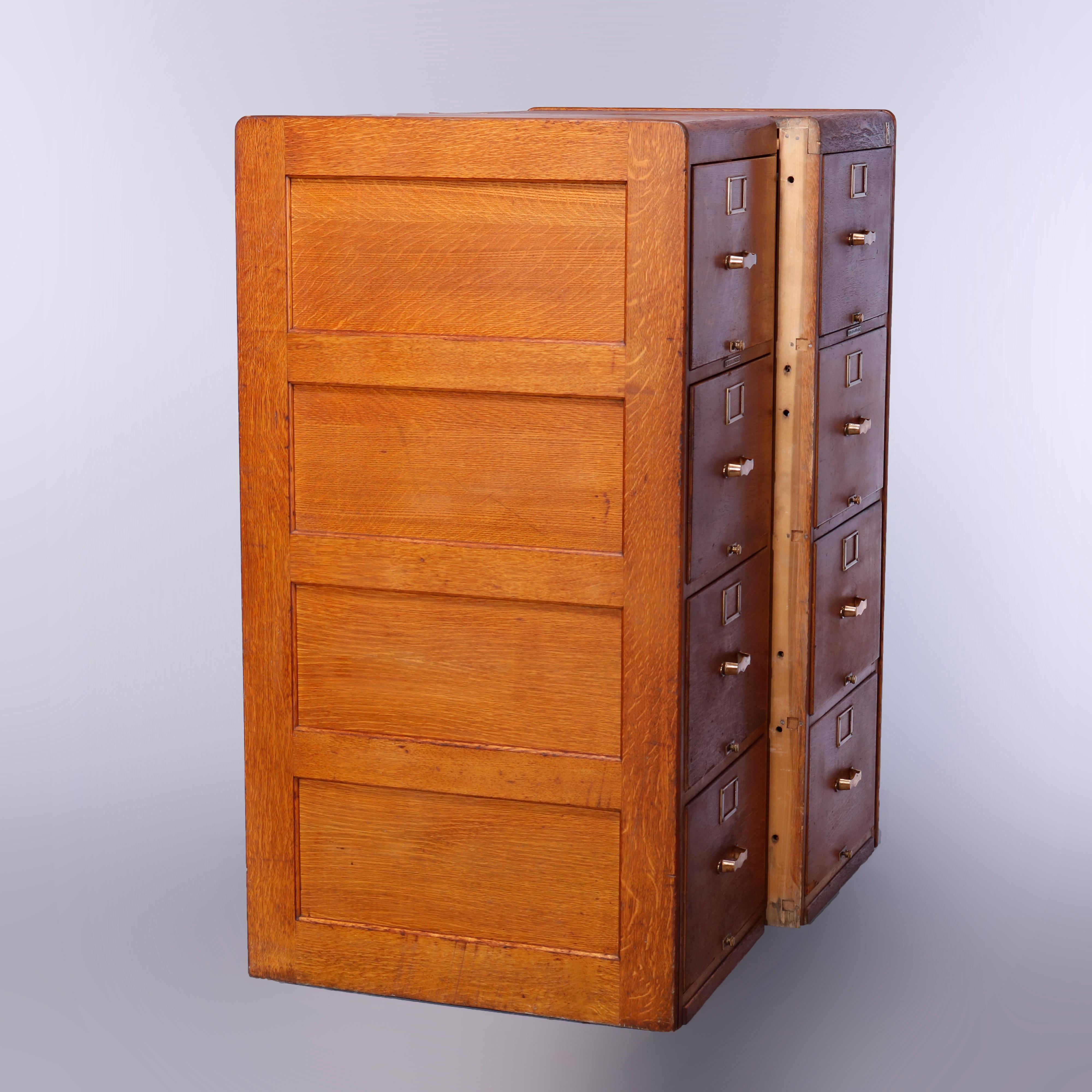 An antique pair of Arts & Crafts filing cabinets by Yale offer paneled quarter sawn oak construction each with four drawers, maker marked on hardware and Library Bureau Makers plaque as photographed, c1910

Measures: 51.75