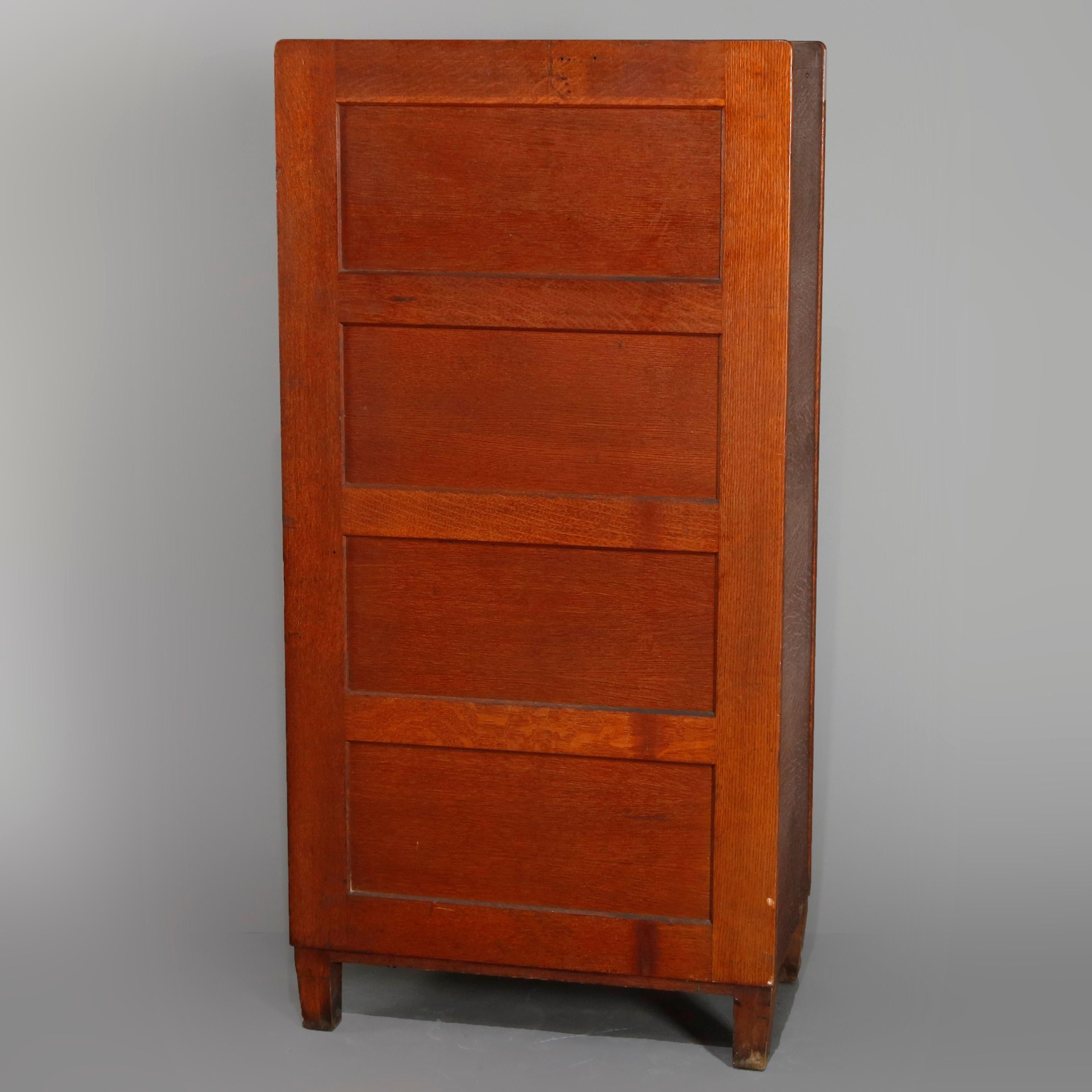 An antique Arts & Crafts mission oak filing cabinet by Yawman & Erbe offers paneled construction with 10 drawers having bronze pulls, raised on square and tapered legs, maker mark as photographed, circa 1910

Measures: 55.5
