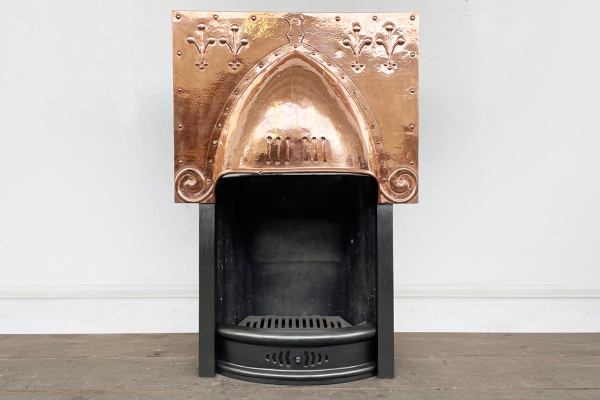 Polished antique Arts & Crafts copper canopy on legs, complete with a new clay fireback and cast iron bottom grate. Illustrated with replacement tiled back, not included in the prices, but we would be happy to discuss tile options with you as a wide