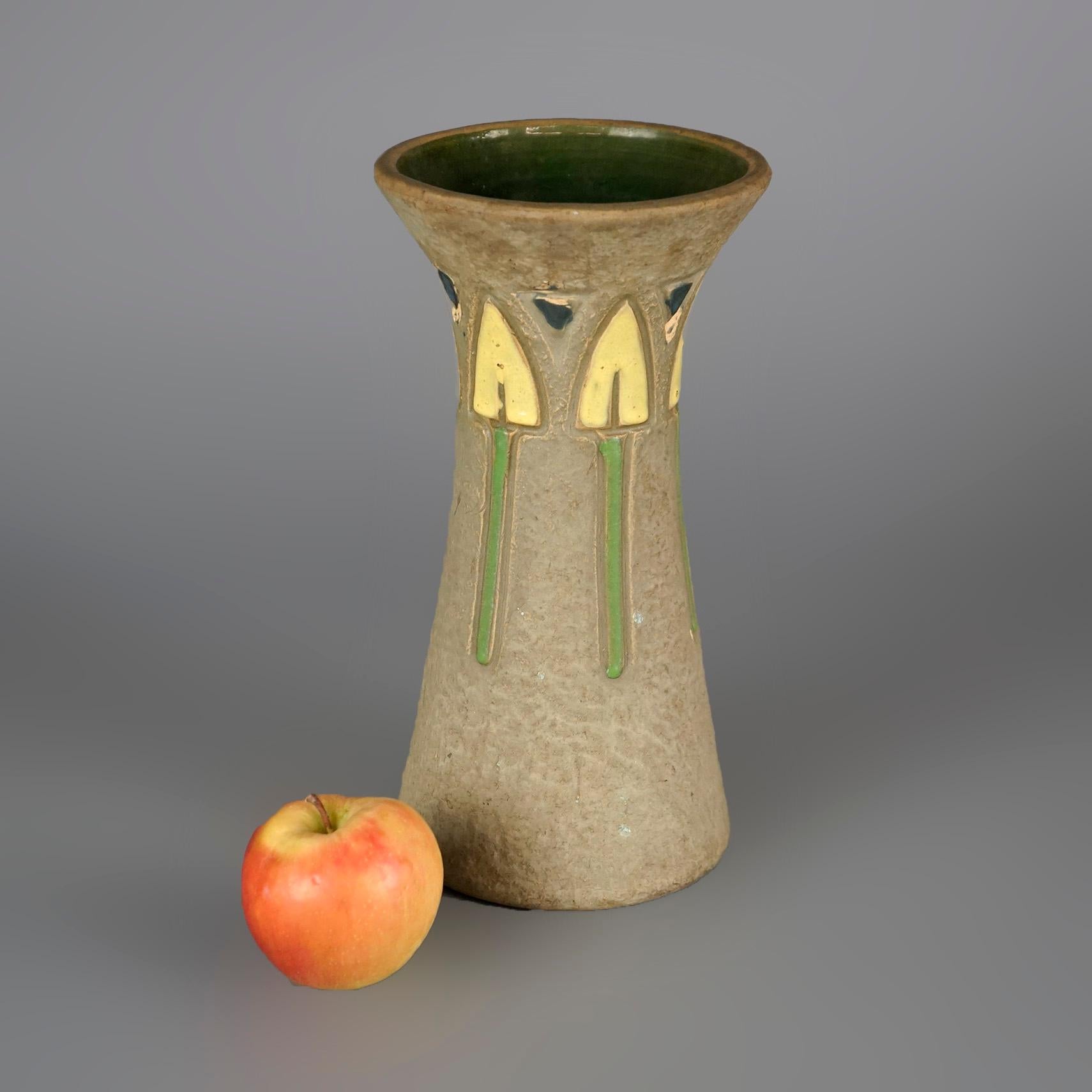 An antique Arts and Crafts Roseville Mostique vase offers art pottery construction with stylized flowers in surround, c1930

Measures- 10.25''H x 4.75''W x 4.75''D

Catalogue Note: Ask about DISCOUNTED DELIVERY RATES available to most regions within