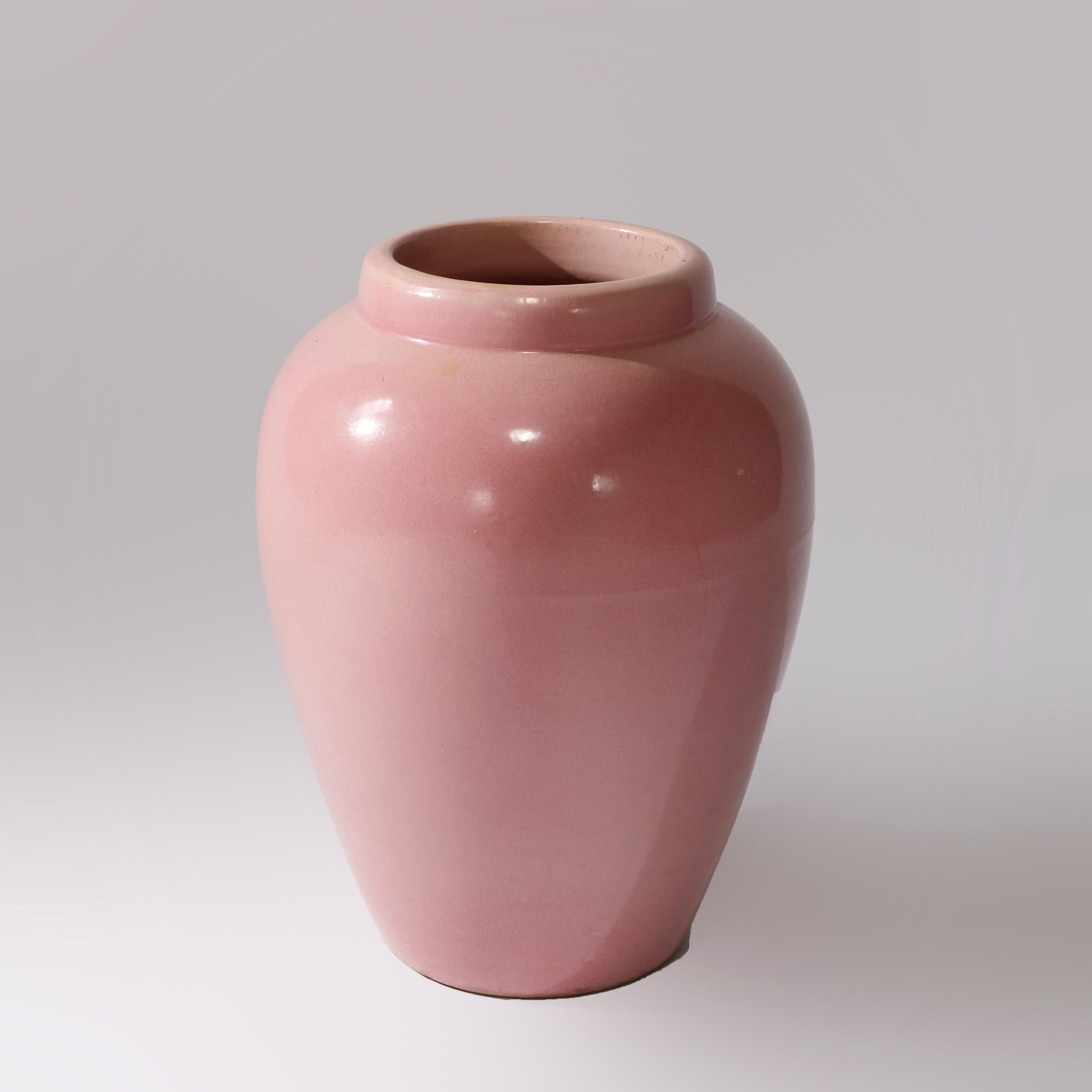 An antique Arts and Crafts floor vase in the manner of Roseville offers art pottery construction in bulbous form, c1920

Measures - 18.25''H x 12.5''W x 12.5''D.

Catalogue Note: Ask about DISCOUNTED DELIVERY RATES available to most regions within