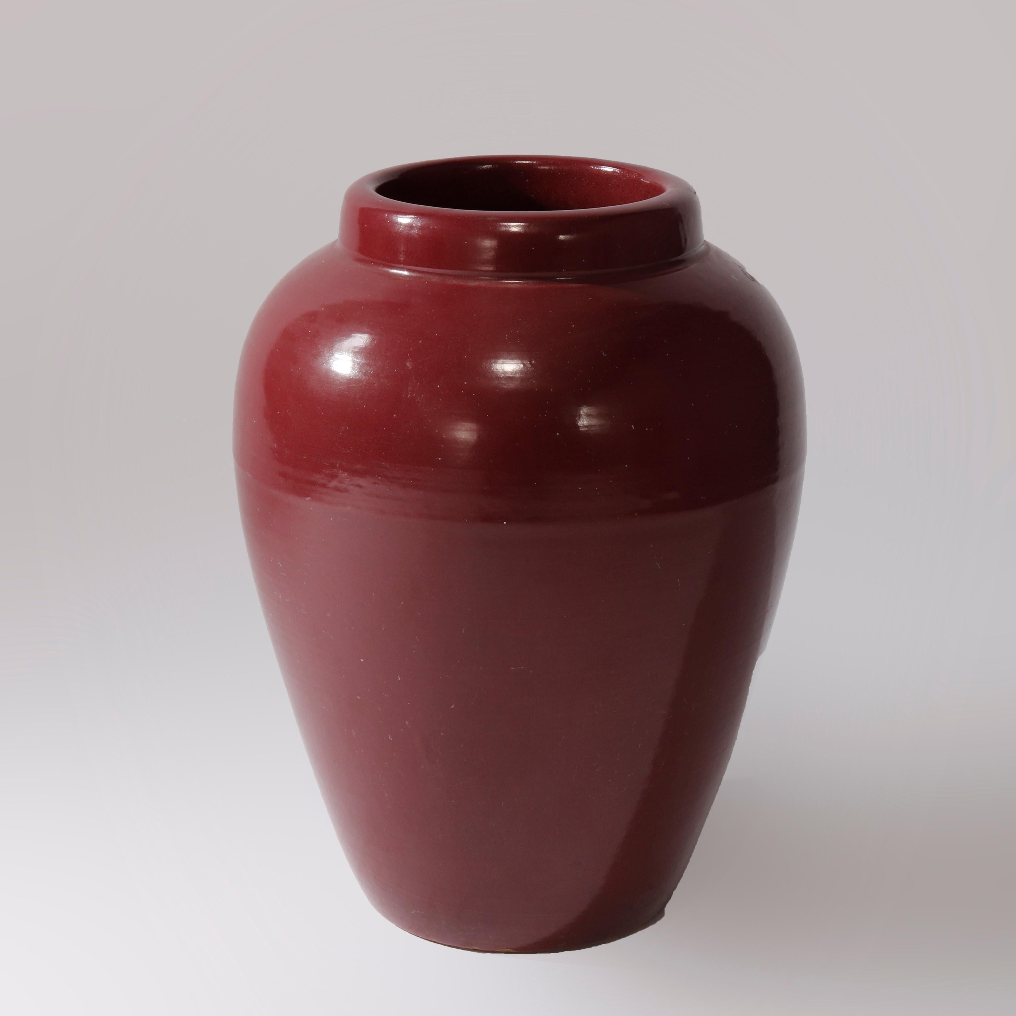 An antique Arts & Crafts floor vase in the manner of Roseville offers art pottery construction in bulbous form, c1920

Measures - 18'' H x 13'' W x 13'' D.

Catalogue Note: Ask about DISCOUNTED DELIVERY RATES available to most regions within 1,500