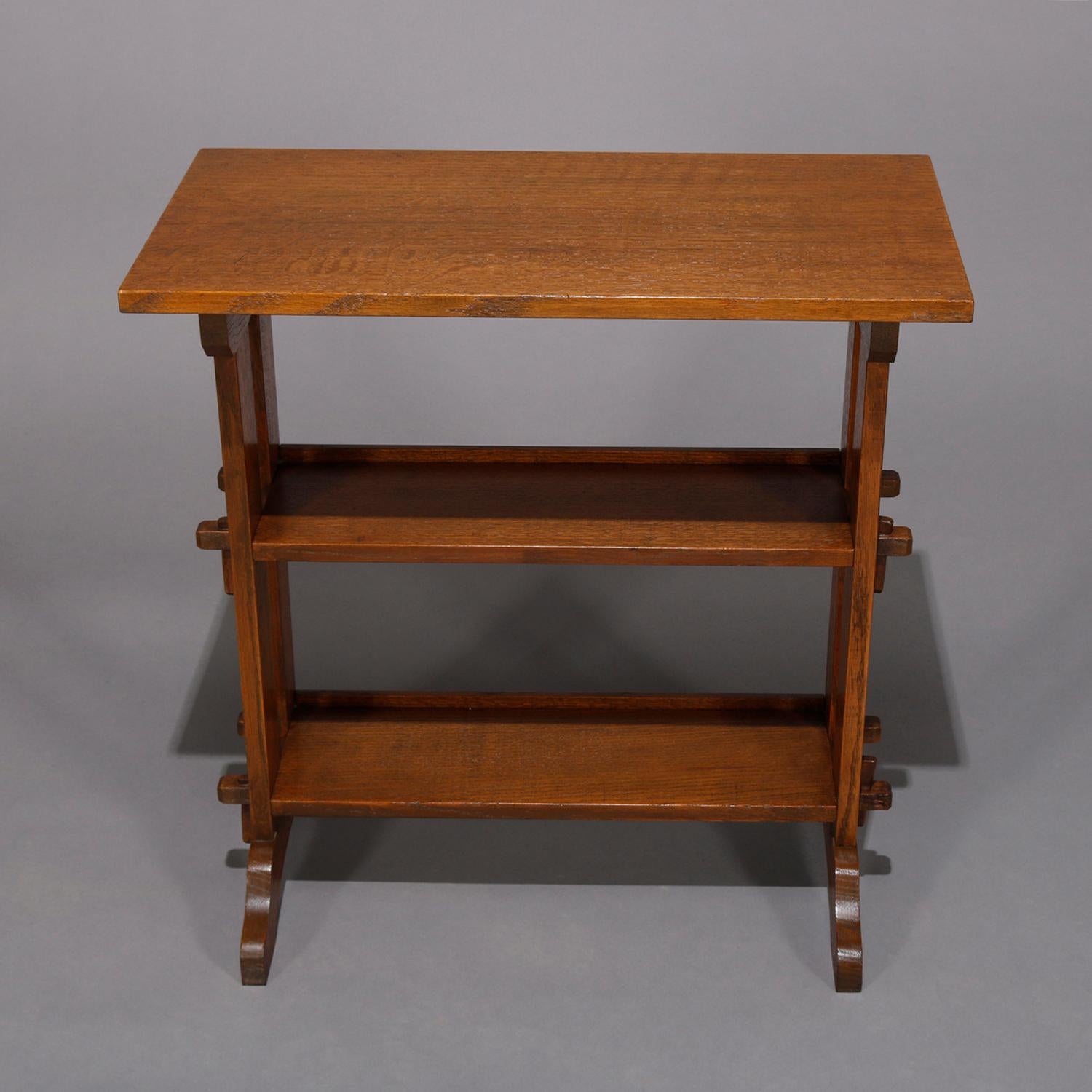 An antique Arts & Crafts mission oak little journey bookstand by Roycroft offers quarter sawn oak construction with upper counter over two mortise and tenon shelves, maker label as photographed, circa 1900.

***DELIVERY NOTICE – Due to COVID-19 we